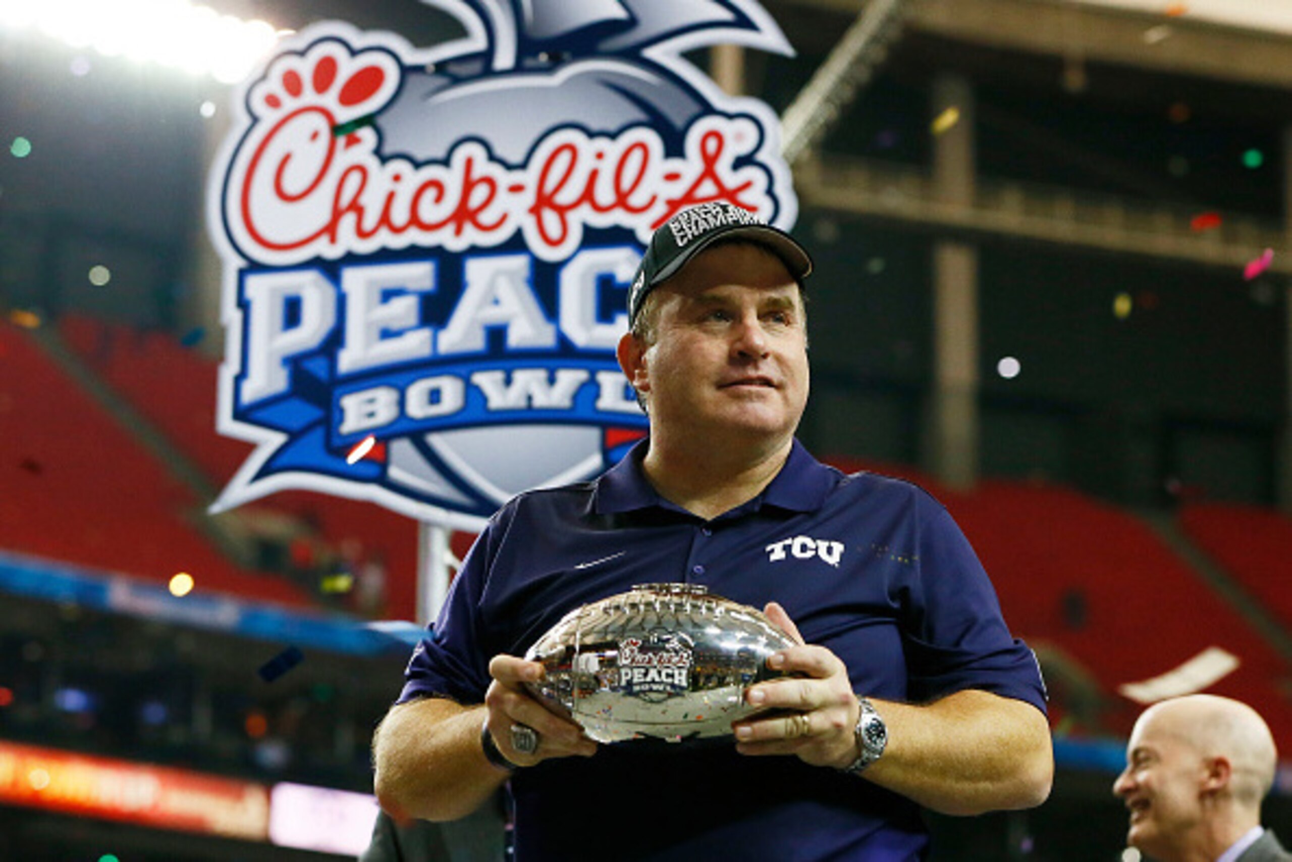 ATLANTA, GA - DECEMBER 31: Head coach Gary Patterson of the TCU Horned Frogs celebrates with the trophy after their 42 to 3 win over the Ole Miss Rebels during the Chik-fil-A Peach Bowl at Georgia Dome on December 31, 2014 in Atlanta, Georgia. (Photo by ATLANTA, GA - DECEMBER 31: Head coach Gary Patterson of the TCU Horned Frogs celebrates with the trophy after their 42 to 3 win over the Ole Miss Rebels during the Chik-fil-A Peach Bowl at Georgia Dome on December 31, 2014 in Atlanta, Georgia. (Photo by