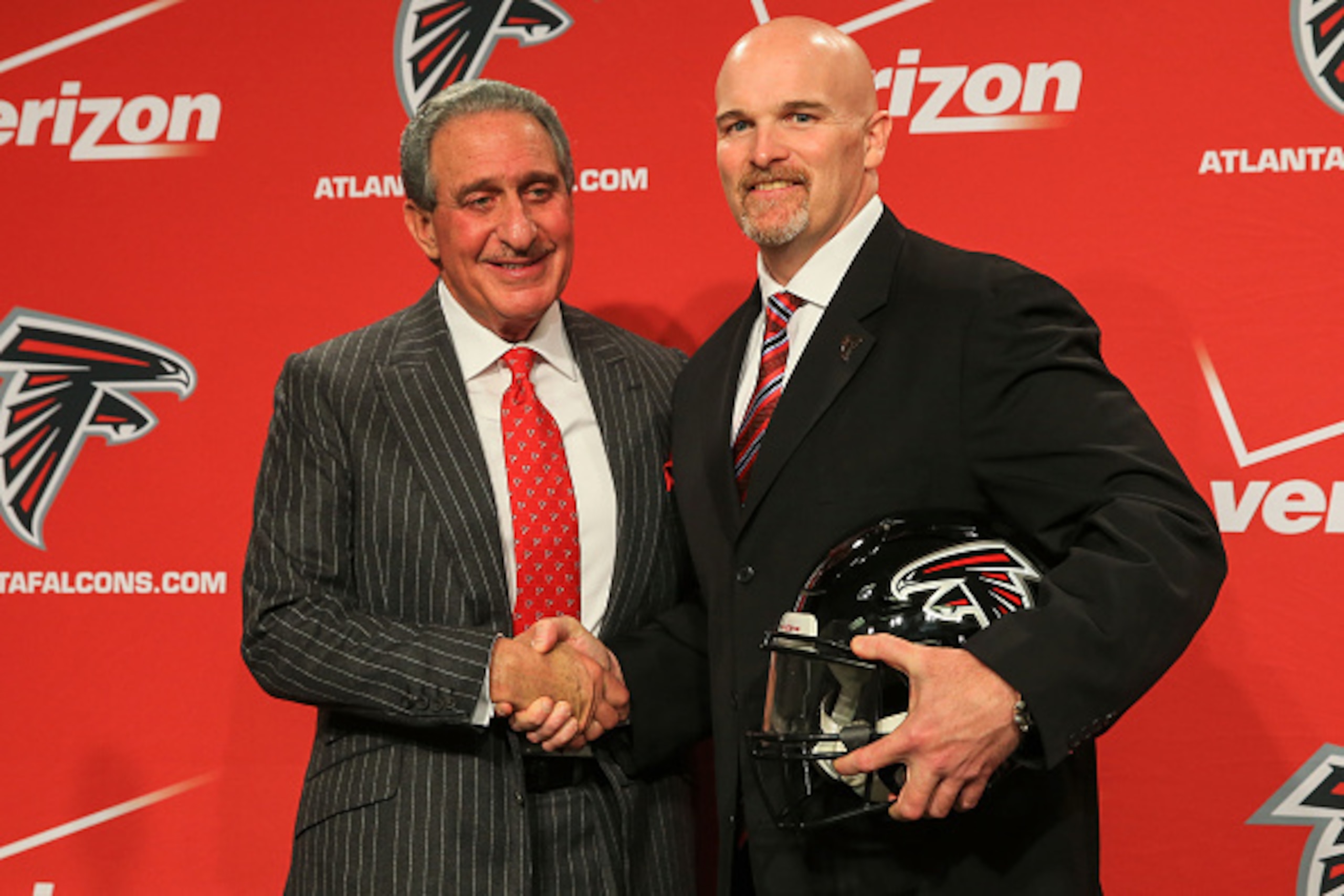 FLOWERY BRANCH, GA - FEBRUARY 03: Atlanta Falcons owner, Arthur Blank (L) poses with new head coach, Dan Quinn, during a press conference at the Atlanta Falcons Training Facility on February 3, 2015 in Flowery Branch, Georgia.  (Photo by Daniel Shirey/Get