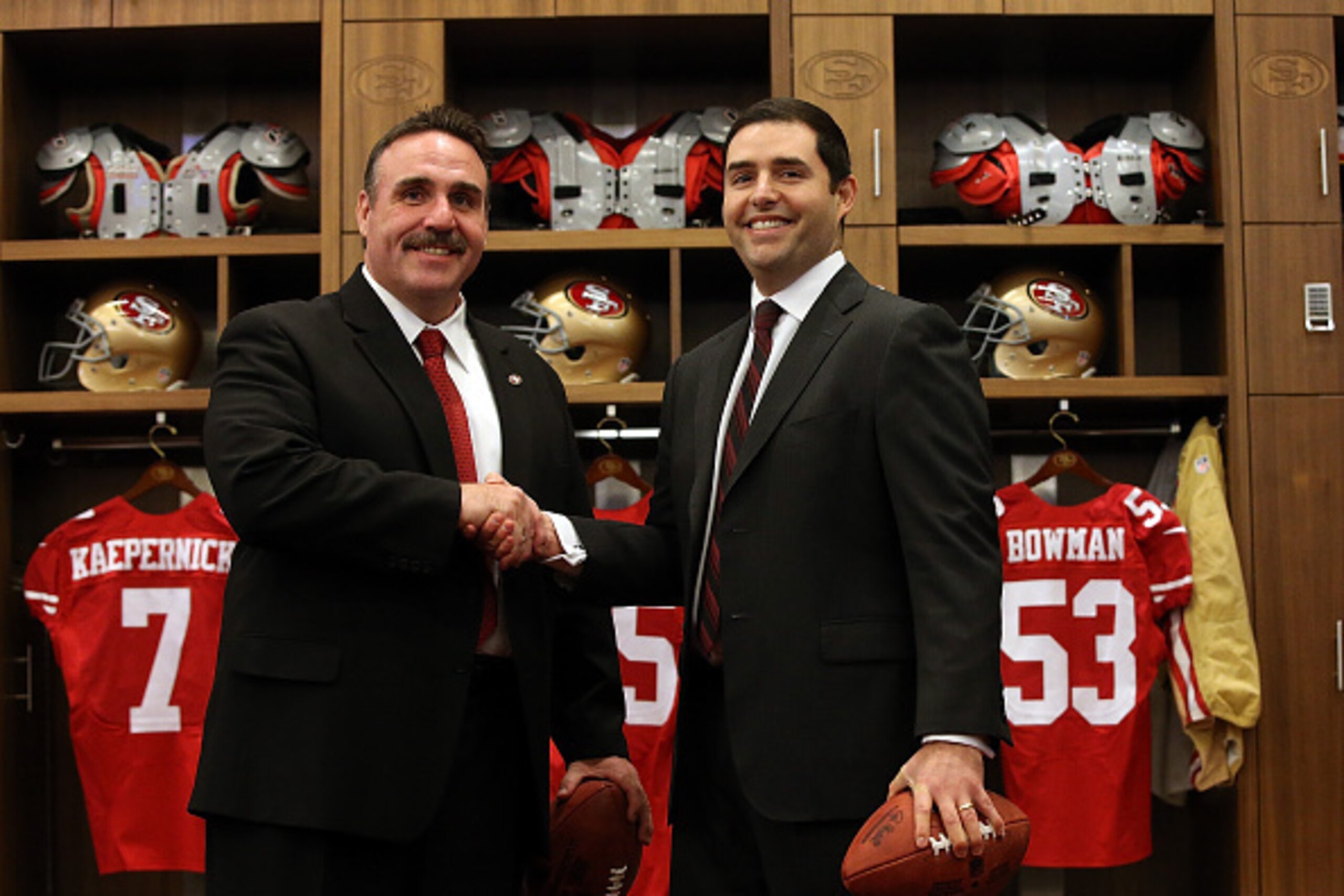 SANTA CLARA, CA - JANUARY 15:  Jim Tomsula (L) shakes hands with San Francisco 49ers CEO Jed York (R) following a press conference at Levi's Stadium on January 15, 2015 in Santa Clara, California. The San Francisco 49ers announced Jim Tomsula as their new