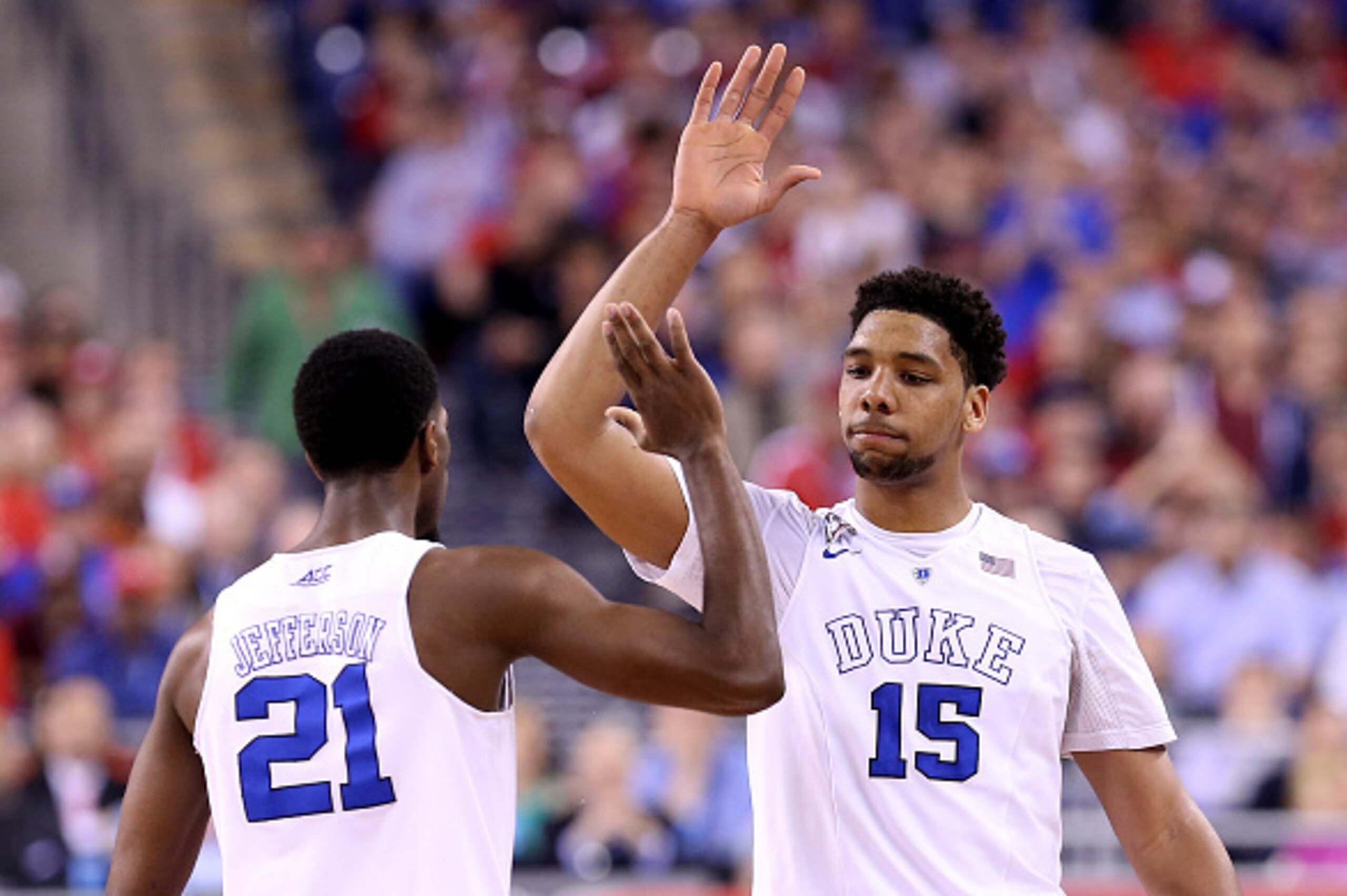 INDIANAPOLIS, IN - APRIL 06: Amile Jefferson #21 and Jahlil Okafor #15 of the Duke Blue Devils react after a play in the first half against the Wisconsin Badgers during the NCAA Men's Final Four National Championship at Lucas Oil Stadium on April 6, 2015 