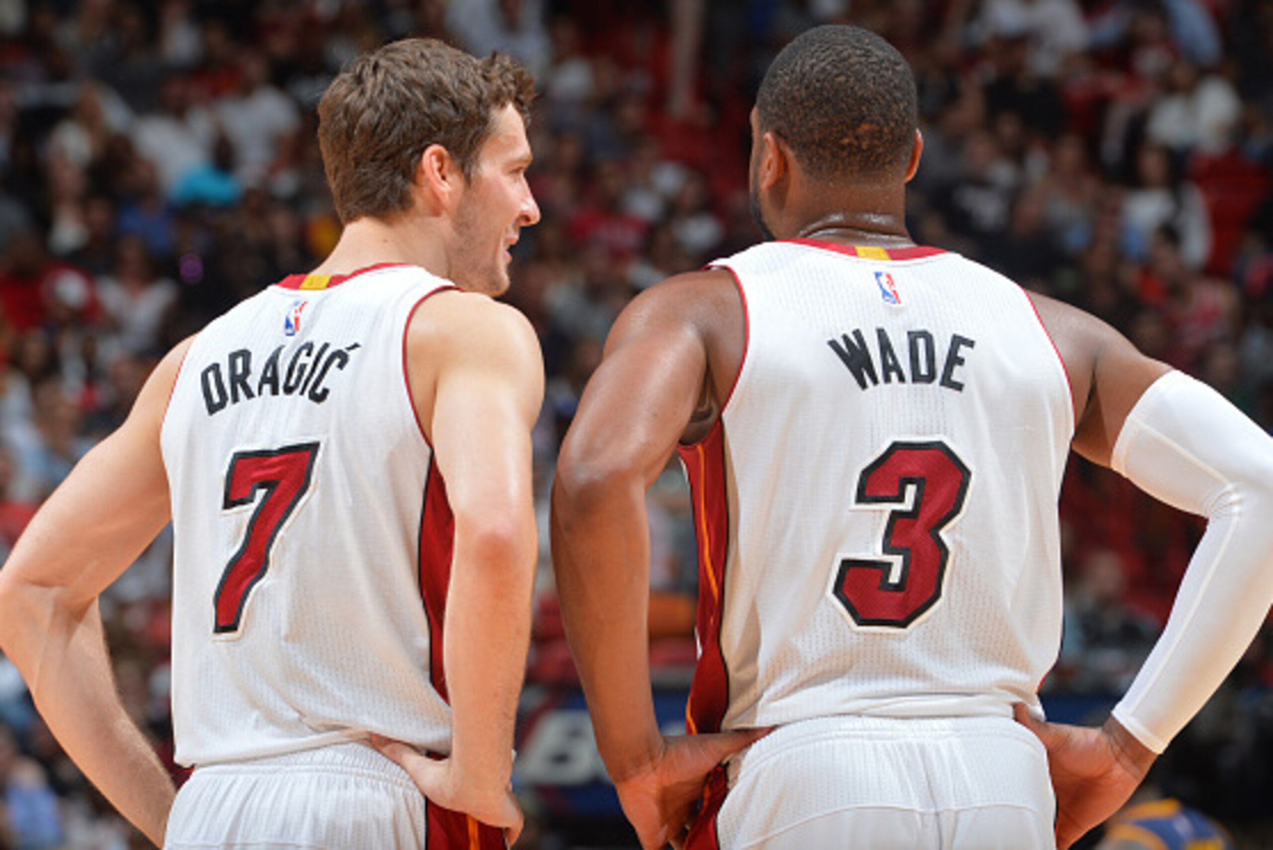 Miami,FL - MARCH 16:  Goran Dragic #7 and Dwyane Wade #3 of the Miami Heat look on against the Cleveland Cavaliers at the American Airlines Arena on March 16, 2015 in Miami,Florida.NOTE TO USER: User expressly acknowledges and agrees that, by downloading 