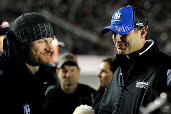 DAYTONA BEACH, FL - FEBRUARY 19:  Dale Earnhardt Jr., driver of the #88 Nationwide Chevrolet, left, and crew chief Greg Ives take part in pre-race ceremonies for the NASCAR Sprint Cup Series Budweiser Duel 1 at Daytona International Speedway on February 1