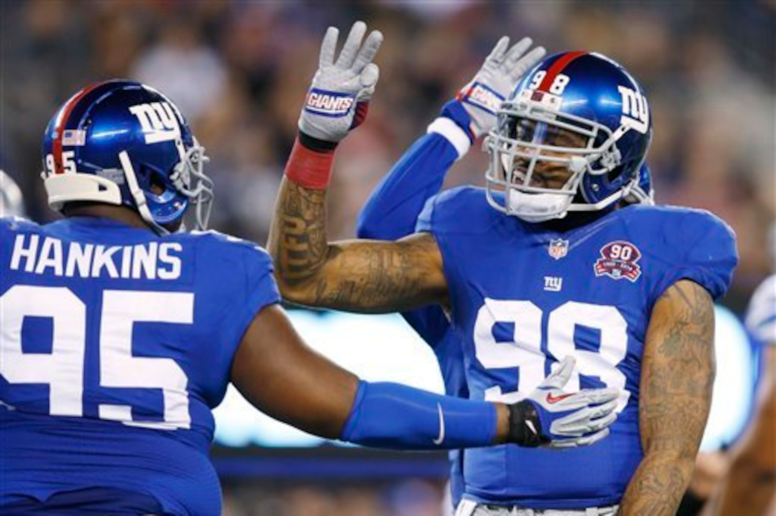 Johnathan Hankins (left) and Damontre Moore could be part of the future on the Giants' defensive line.