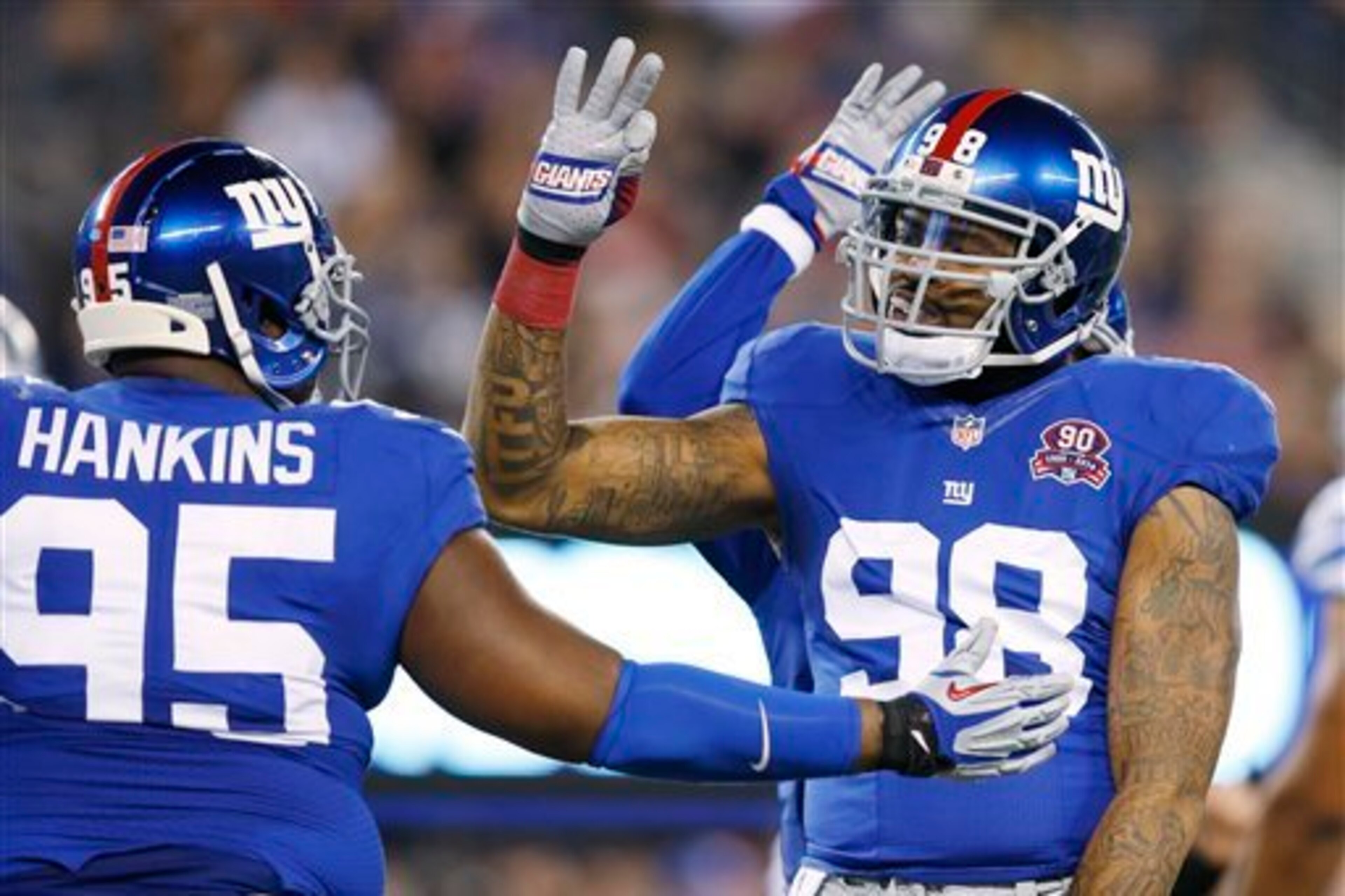 Johnathan Hankins (left) and Damontre Moore could be part of the future on the Giants' defensive line.