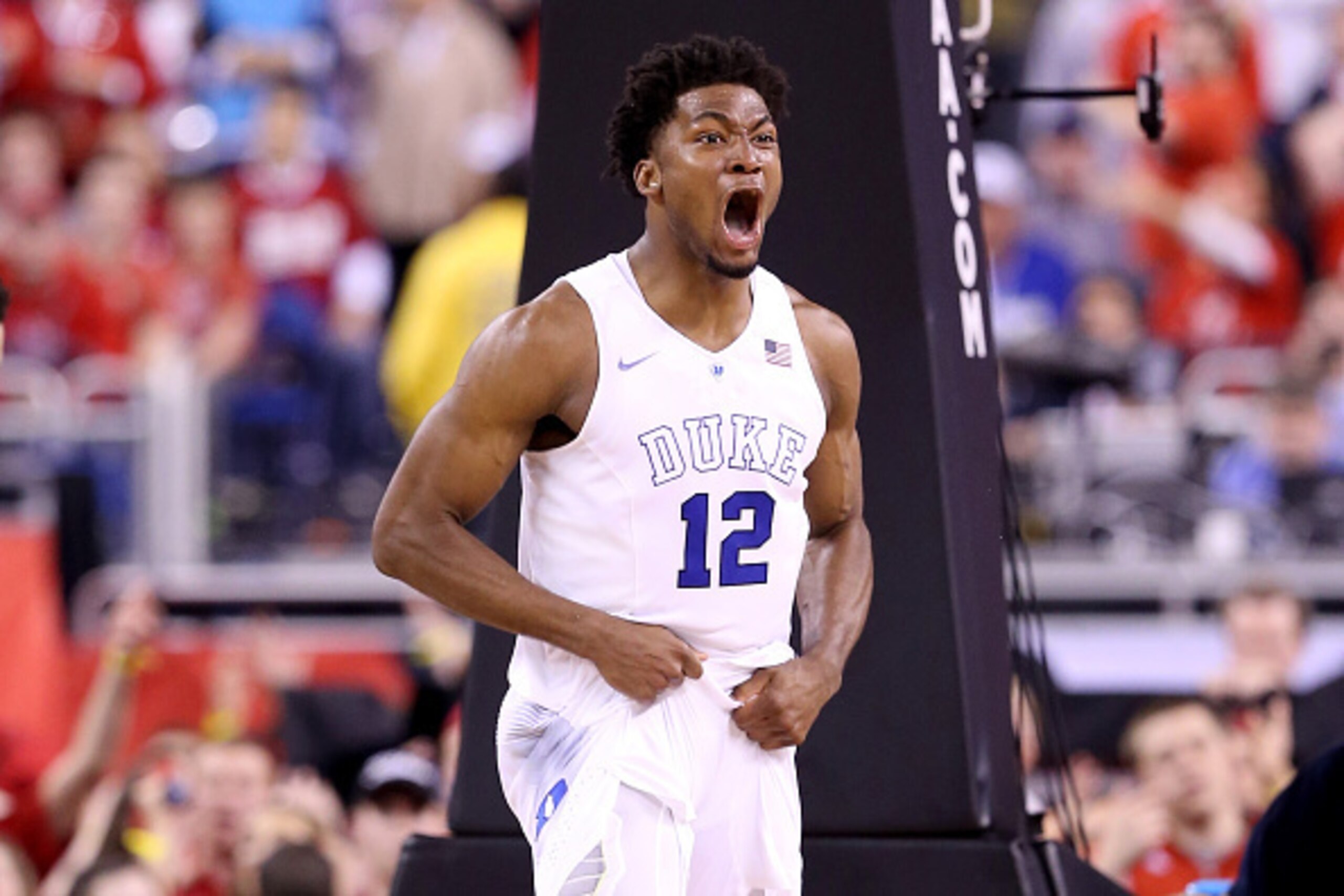 INDIANAPOLIS, IN - APRIL 06:  Justise Winslow #12 of the Duke Blue Devils reacts after a play in the second half against the Wisconsin Badgers during the NCAA Men's Final Four National Championship at Lucas Oil Stadium on April 6, 2015 in Indianapolis, In