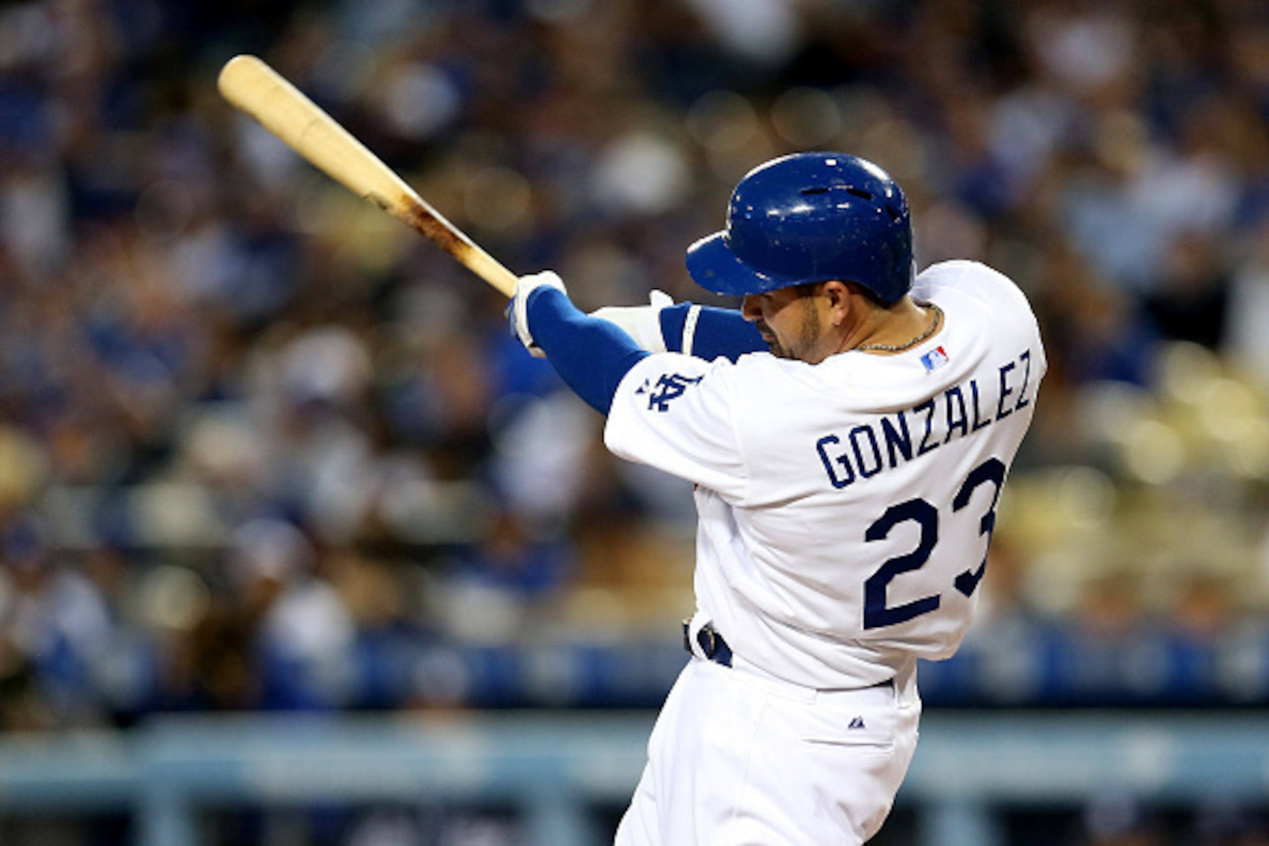 LOS ANGELES, CA - APRIL 08:  Adrian Gonzalez #23 of the Los Angeles Dodgers hits a solo home run in the first inning against the San Diego Padres at Dodger Stadium on April 8, 2015 in Los Angeles, California.  (Photo by Stephen Dunn/Getty Images)