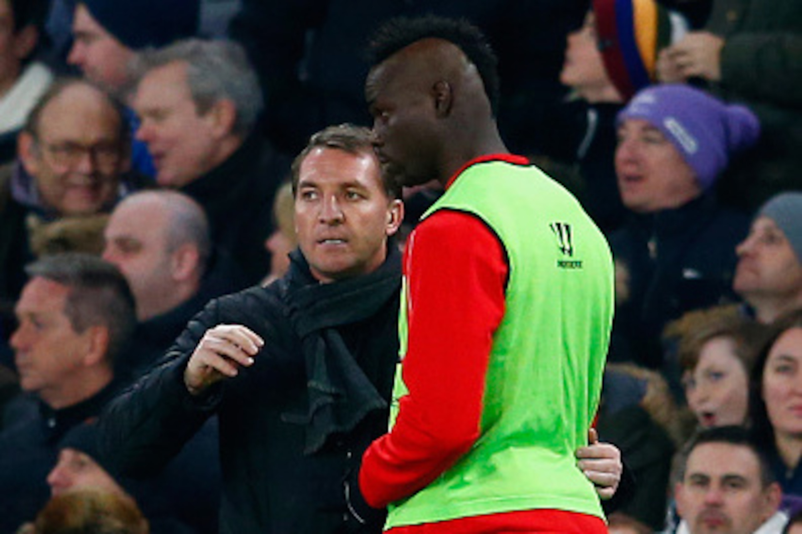 LONDON, ENGLAND - JANUARY 27:  Brendan Rodgers, manager of Liverpool speaks to Mario Balotelli of Liverpool during the Capital One Cup Semi-Final second leg between Chelsea and Liverpool at Stamford Bridge on January 27, 2015 in London, England.  (Photo b