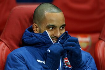 LONDON, ENGLAND - FEBRUARY 25:  Theo Walcott of Arsenal looks on from the substitutes bench during the UEFA Champions League round of 16, first leg match between Arsenal and Monaco at The Emirates Stadium on February 25, 2015 in London, United Kingdom.  (