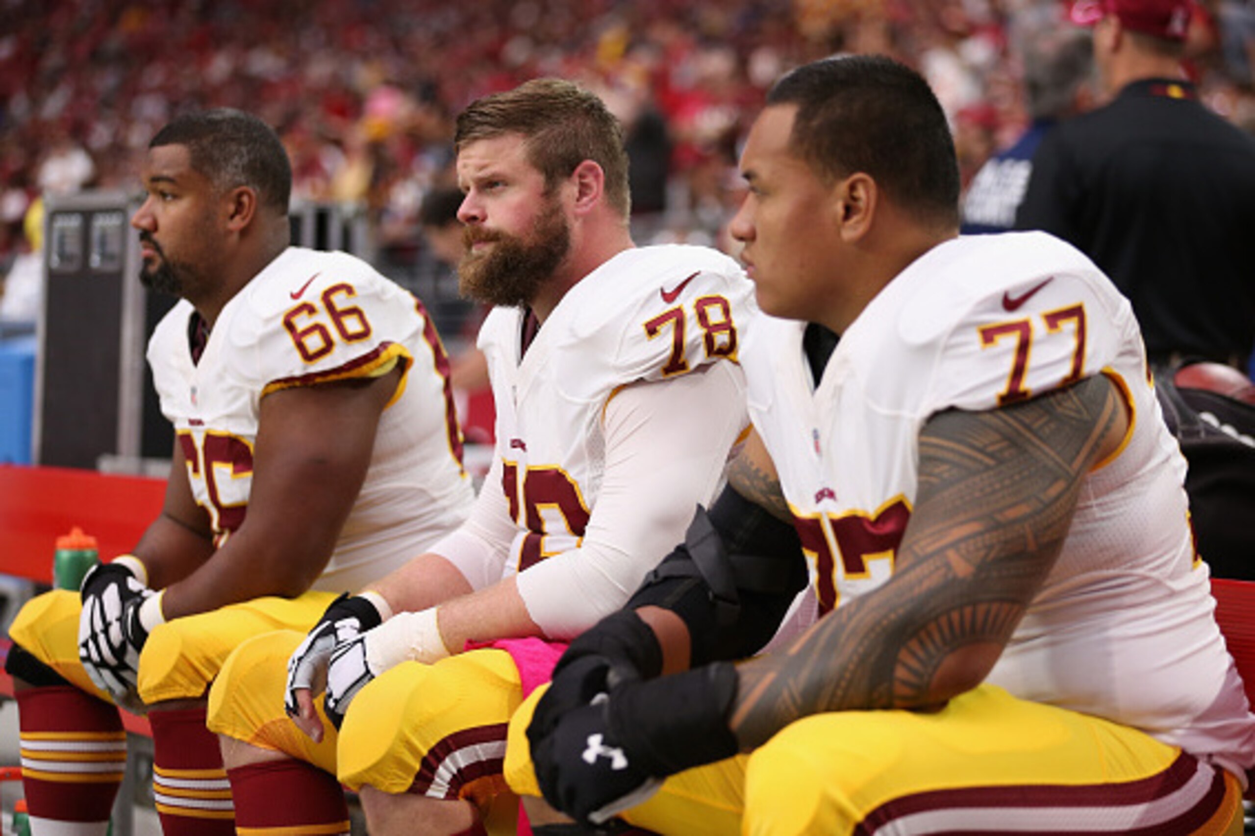 GLENDALE, AZ - OCTOBER 12:  (L-R) guard Chris Chester #66, center Kory Lichtensteiger #78 and guard Shawn Lauvao #77 of the Washington Redskins on the bench during the NFL game against the Arizona Cardinals at the University of Phoenix Stadium on October 