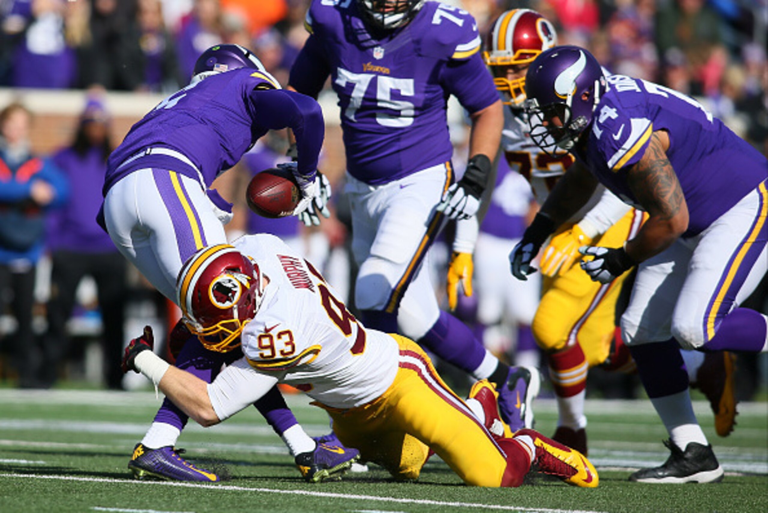 MINNEAPOLIS, MN - NOVEMBER 2:  Teddy Bridgewater #5 of the Minnesota Vikings gets sacked by Trent Murphy #93 of the Washington Redskins during the second quarter on November 2, 2014 at TCF Bank Stadium in Minneapolis, Minnesota. (Photo by Adam Bettcher/Ge
