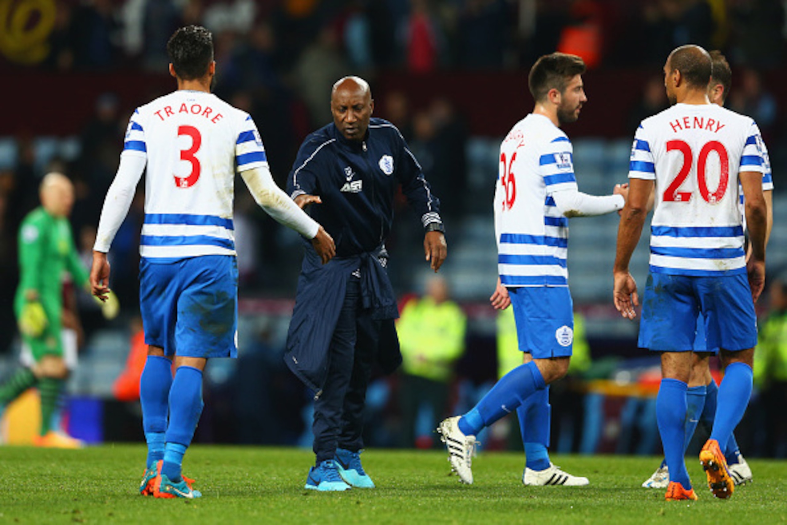 BIRMINGHAM, ENGLAND - APRIL 07:  Chris Ramsey manager of QPR shakes hands with Armand Traore of QPR after the Barclays Premier League match between Aston Villa and Queens Park Rangers at Villa Park on April 7, 2015 in Birmingham, England.  (Photo by Matth