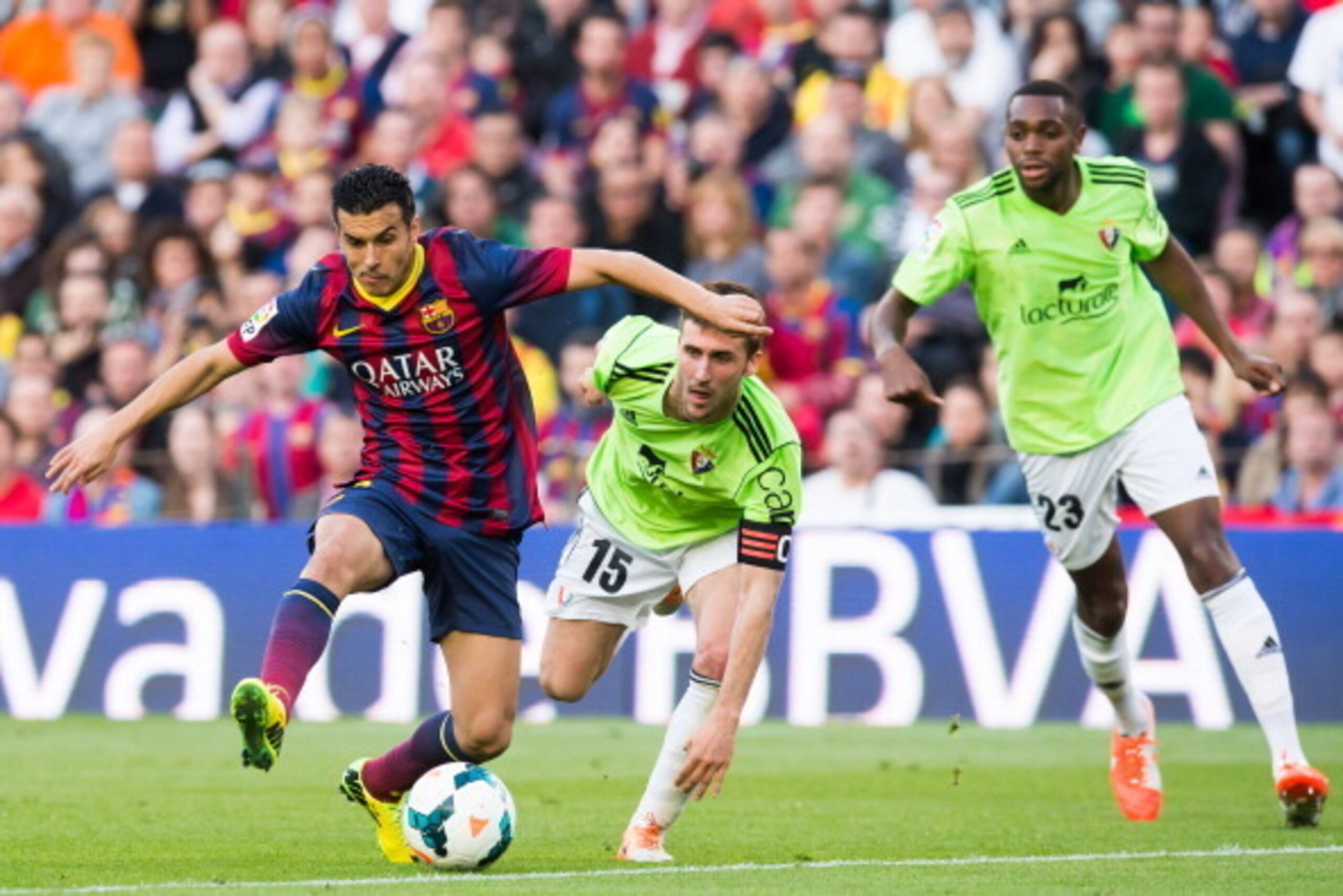 BARCELONA, SPAIN - MARCH 16: Pedro Rodriguez of FC Barcelona plays the ball alongside Oier Sanjurjo (C) and Raoul Cedric Loe (R) of CA Osasuna during the La Liga match between FC Barcelona and CA Osasuna at Camp Nou on March 16, 2014 in Barcelona, Spain. BARCELONA, SPAIN - MARCH 16: Pedro Rodriguez of FC Barcelona plays the ball alongside Oier Sanjurjo (C) and Raoul Cedric Loe (R) of CA Osasuna during the La Liga match between FC Barcelona and CA Osasuna at Camp Nou on March 16, 2014 in Barcelona, Spain.