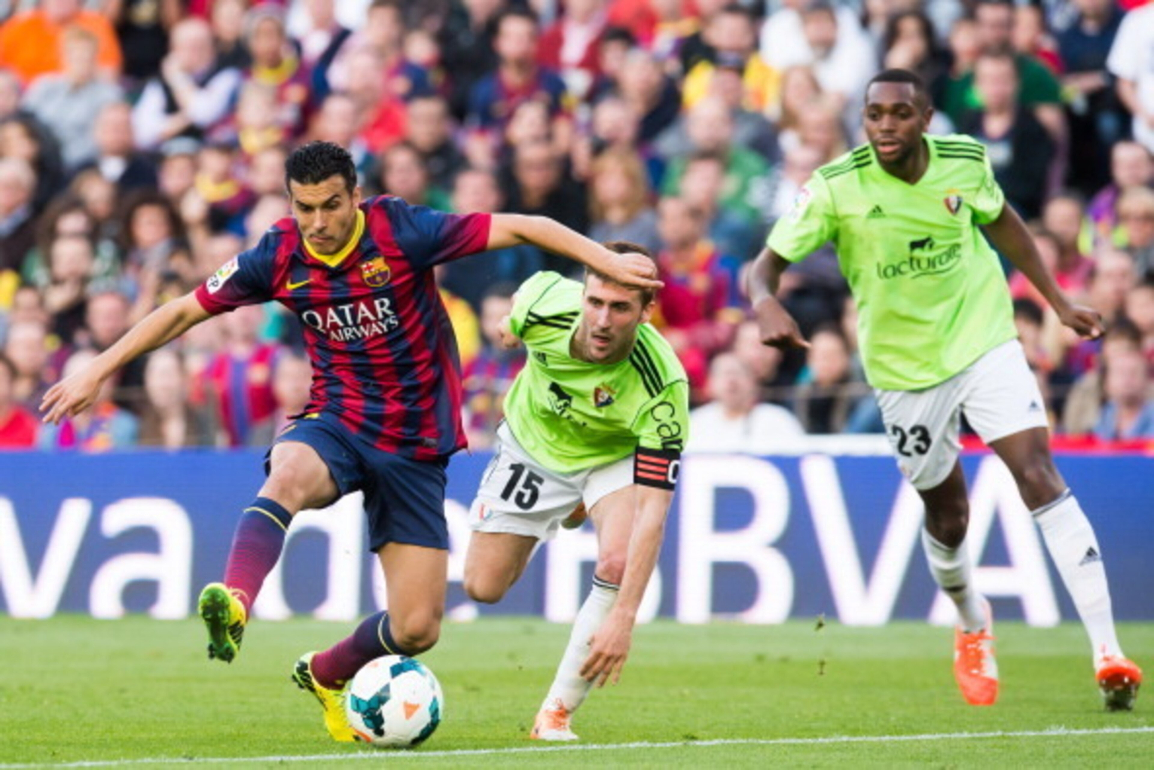 BARCELONA, SPAIN - MARCH 16: Pedro Rodriguez of FC Barcelona plays the ball alongside Oier Sanjurjo (C) and Raoul Cedric Loe (R) of CA Osasuna during the La Liga match between FC Barcelona and CA Osasuna at Camp Nou on March 16, 2014 in Barcelona, Spain. BARCELONA, SPAIN - MARCH 16: Pedro Rodriguez of FC Barcelona plays the ball alongside Oier Sanjurjo (C) and Raoul Cedric Loe (R) of CA Osasuna during the La Liga match between FC Barcelona and CA Osasuna at Camp Nou on March 16, 2014 in Barcelona, Spain.