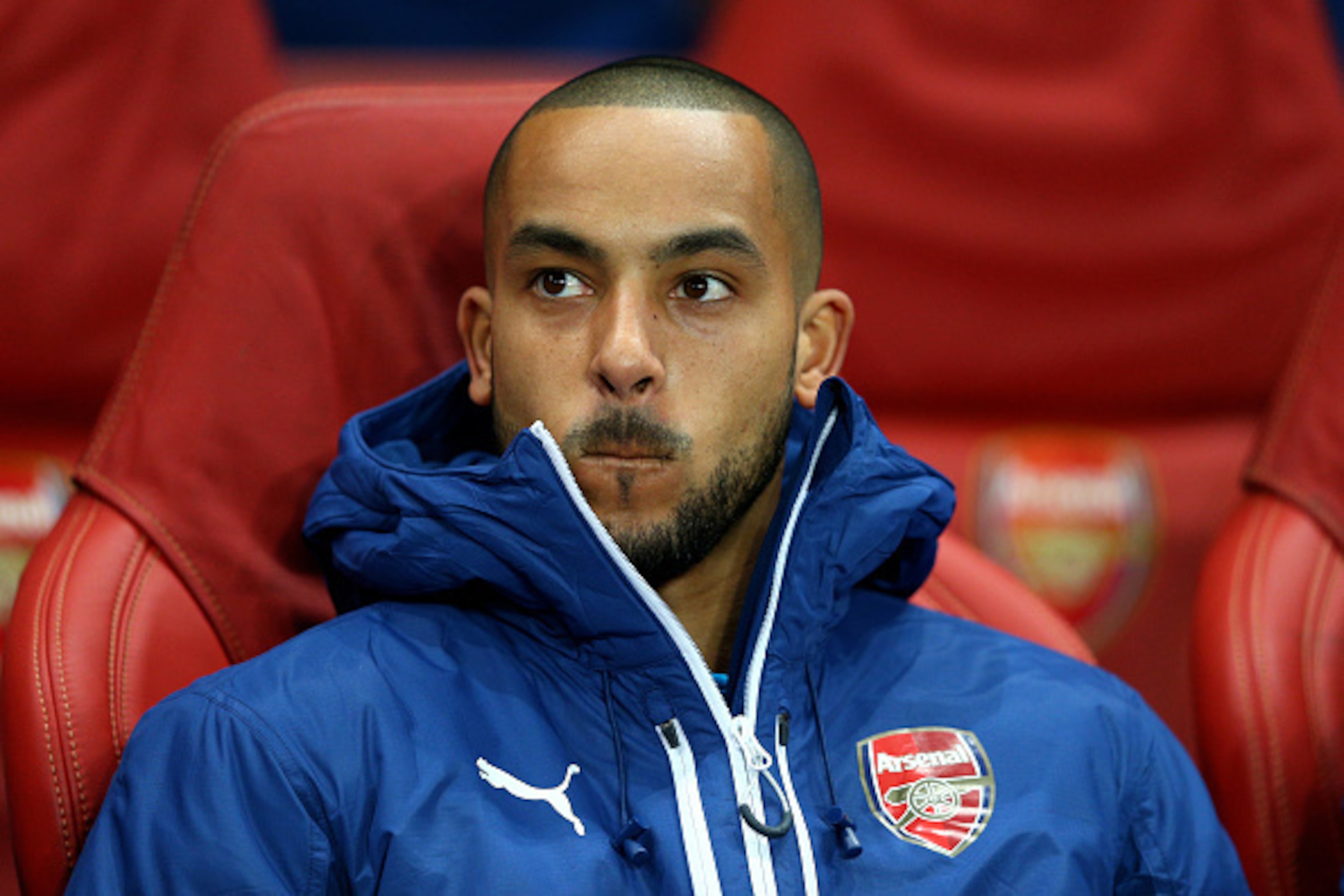 LONDON, ENGLAND - FEBRUARY 25: Theo Walcott of Arsenal looks on from the substitutes bench during the UEFA Champions League round of 16, first leg match between Arsenal and Monaco at The Emirates Stadium on February 25, 2015 in London, United Kingdom. ( LONDON, ENGLAND - FEBRUARY 25: Theo Walcott of Arsenal looks on from the substitutes bench during the UEFA Champions League round of 16, first leg match between Arsenal and Monaco at The Emirates Stadium on February 25, 2015 in London, United Kingdom. (