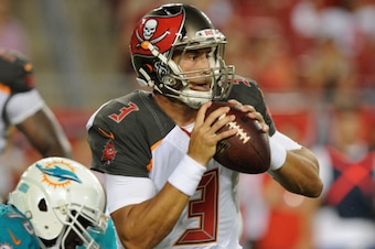 TAMPA, FL - AUGUST 16:  Quarterback Mike Kafka #3 of the Tampa Bay Buccaneers scrambles in the second half against the Miami Dolphins at Raymond James Stadium during a preseason game on August 16, 2014 in Tampa, Florida. (Photo by Cliff McBride/Getty Imag
