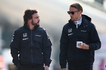 SHANGHAI, CHINA - APRIL 10:  Fernando Alonso of Spain and McLaren Honda and Jenson Button of Great Britain and McLaren Honda walk through the paddock during practice for the Formula One Grand Prix of China at Shanghai International Circuit on April 10, 20