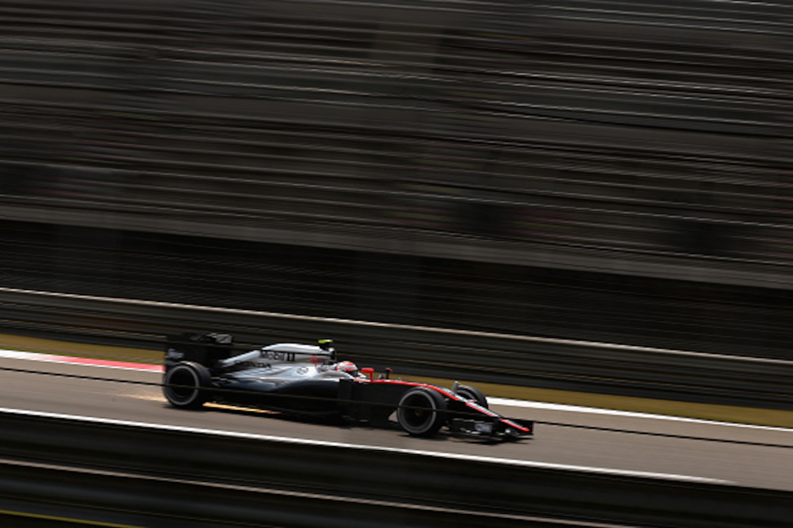 SHANGHAI, CHINA - APRIL 10: Jenson Button of Great Britain and McLaren Honda during practice for the Formula One Grand Prix of China at Shanghai International Circuit on April 10, 2015 in Shanghai, China.  (Photo by Clive Mason/Getty Images)