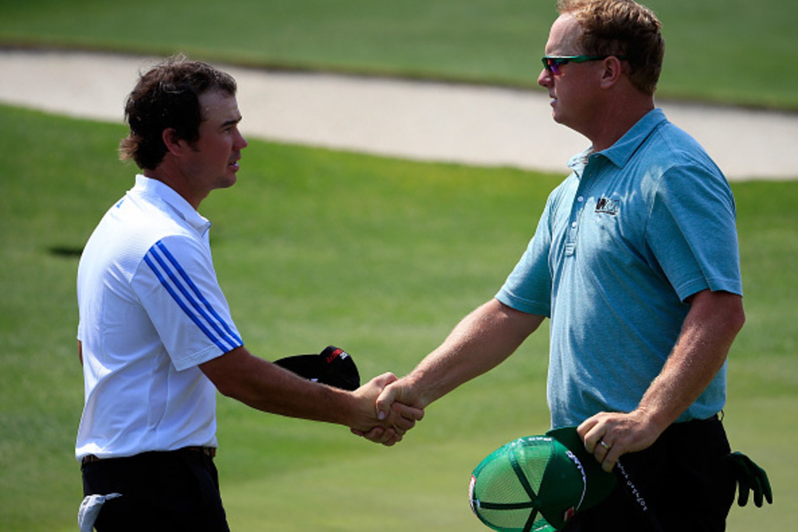AUGUSTA, GA - APRIL 09:  Charley Hoffman of the United States (R) shakes hands with Brian Harman on the 18th green after finishing with a five-under par 67 during the first round of the 2015 Masters Tournament at Augusta National Golf Club on April 9, 201