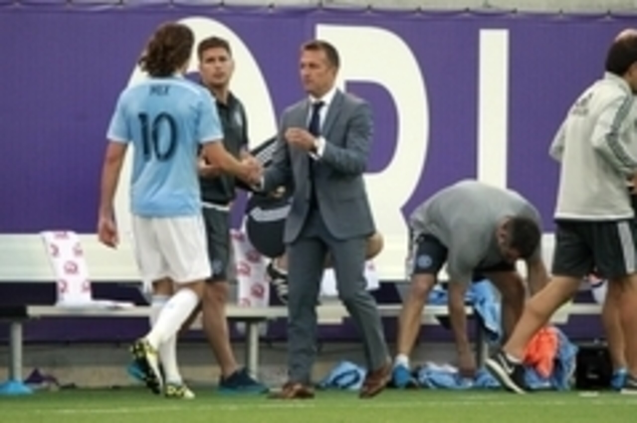 Mar 8, 2015; Orlando, FL, USA; New York City FC midfielder Mix Diskerud (10) is congratulated by head coach Jason Kreis after he was taken out of the game during the second half at Orlando Citrus Bowl Stadium. Orlando City FC and New York City FC tied 1-1