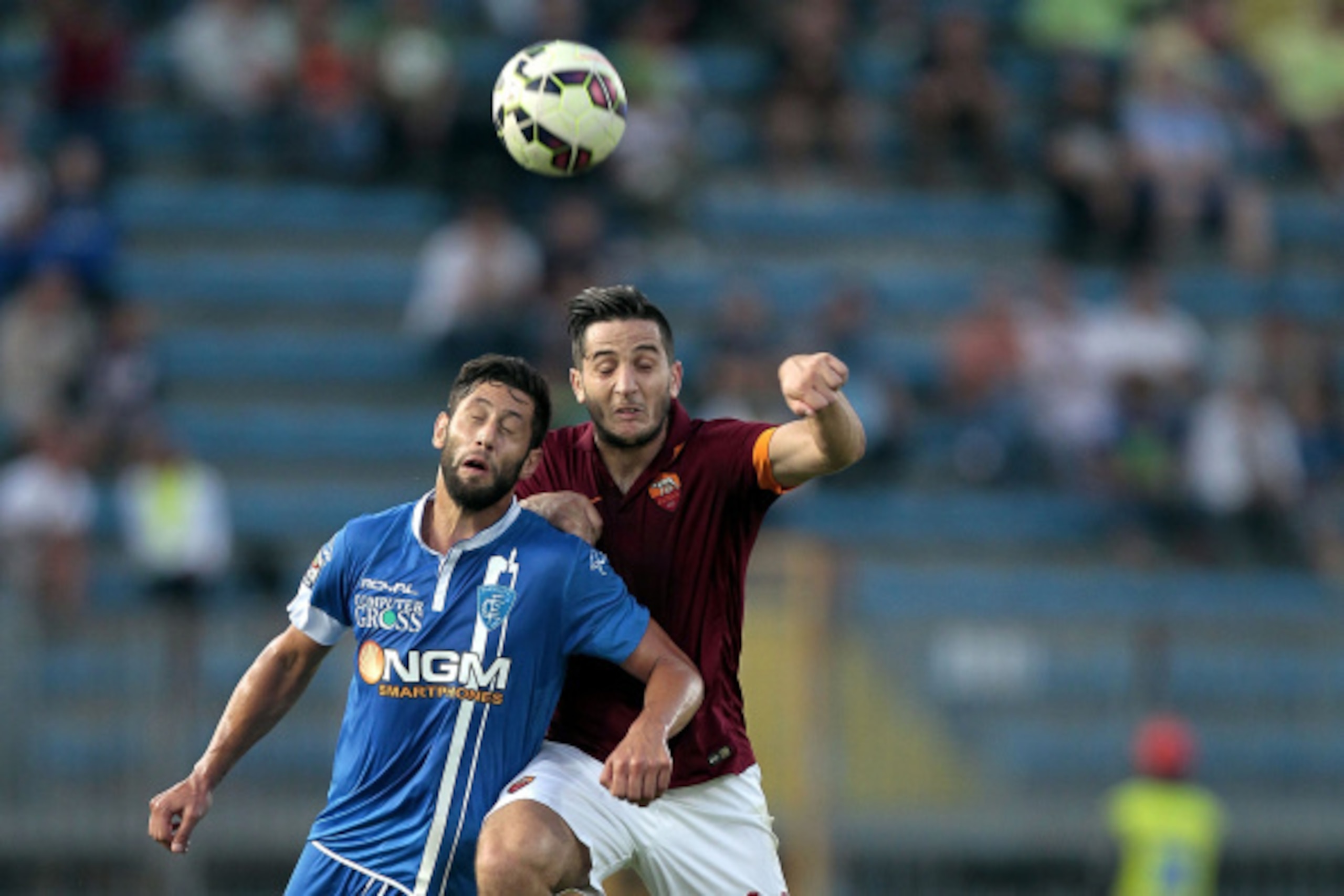EMPOLI, ITALY - SEPTEMBER 13: Levan Mchedlidze of Empoli Fc battles for the ball with Kostas Manolas of AS Roma during the Serie A match between Empoli FC and AS Roma at Stadio Carlo Castellani on September 13, 2014 in Empoli, Italy.  (Photo by Gabriele M