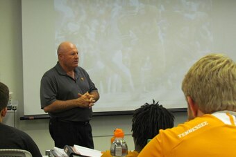 Defensive line coach Steve Stripling addresses his players in the D-line meeting.