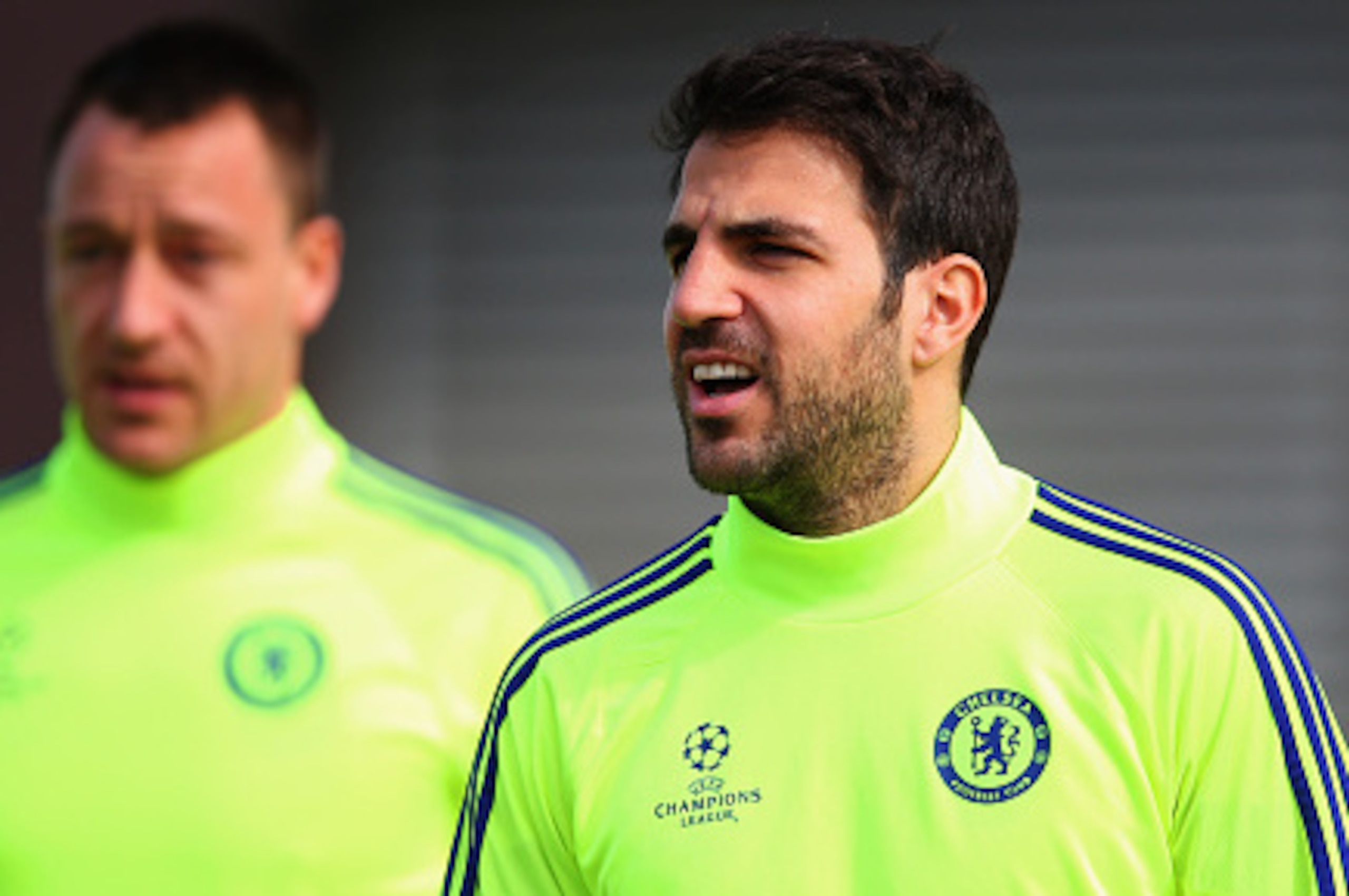 COBHAM, ENGLAND - MARCH 10:  John Terry and Cesc Fabregas (R)  look on during a Chelsea training session ahead of the UEFA Champions League Round of 16 second leg match against Paris Saint-Germain at Chelsea Training Ground on March 10, 2015 in Cobham, En