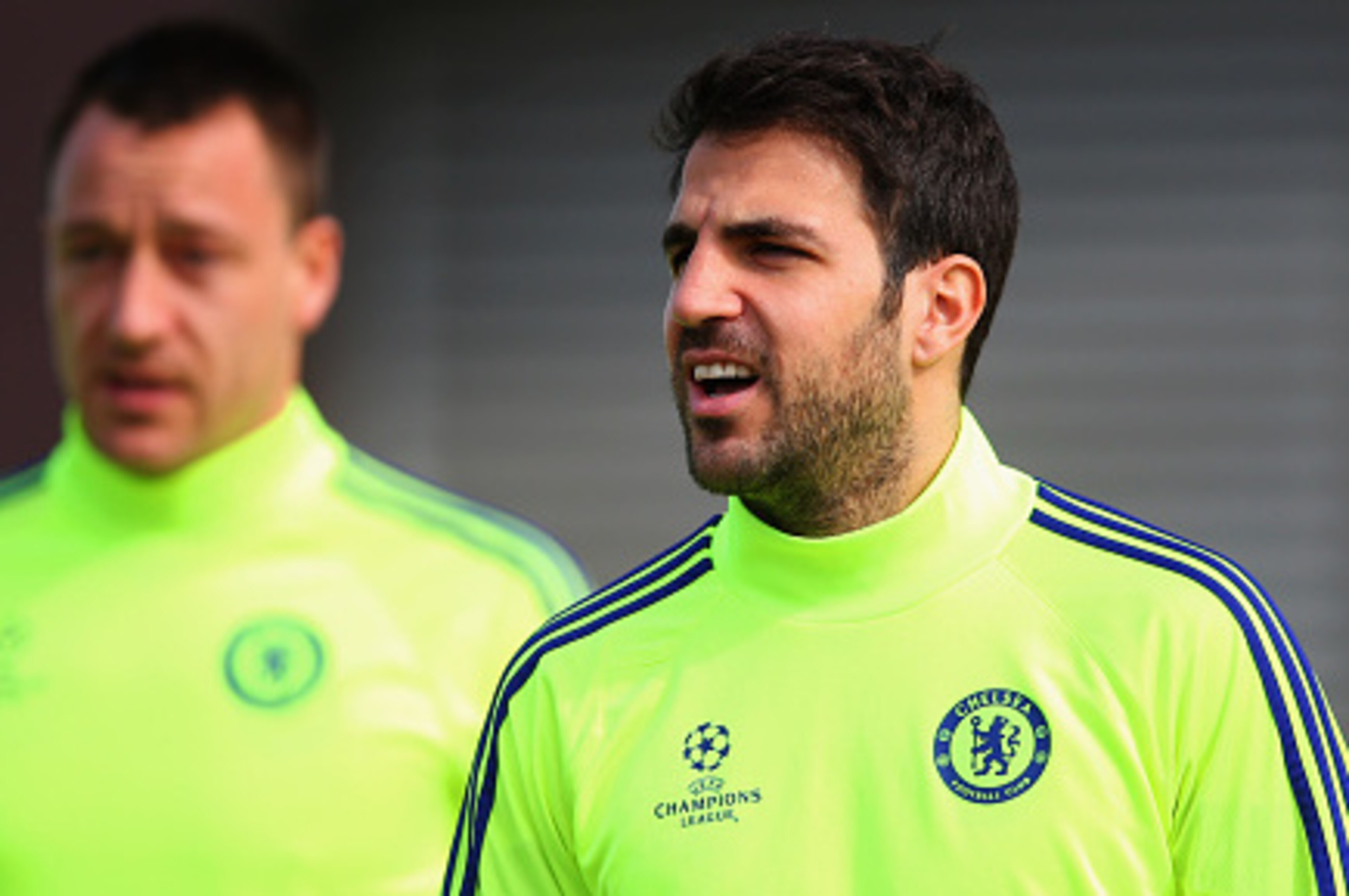 COBHAM, ENGLAND - MARCH 10:  John Terry and Cesc Fabregas (R)  look on during a Chelsea training session ahead of the UEFA Champions League Round of 16 second leg match against Paris Saint-Germain at Chelsea Training Ground on March 10, 2015 in Cobham, En