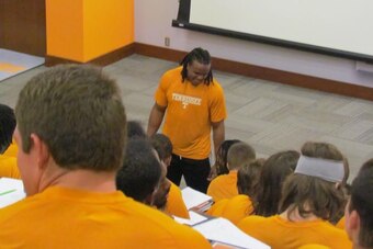 Team leader Curt Maggitt cuts up before team meetings start.