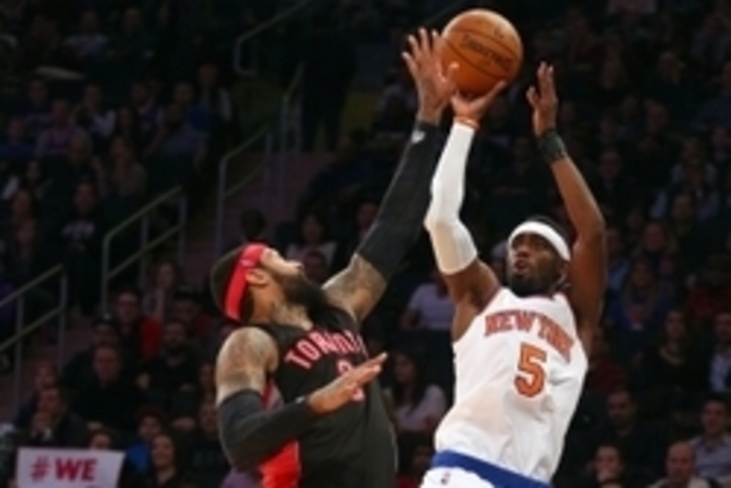 Feb 28, 2015; New York, NY, USA; New York Knicks shooting guard Tim Hardaway Jr. (5) shoots over Toronto Raptors power forward James Johnson (3) during the second half at Madison Square Garden. Mandatory Credit: Brad Penner-USA TODAY Sports