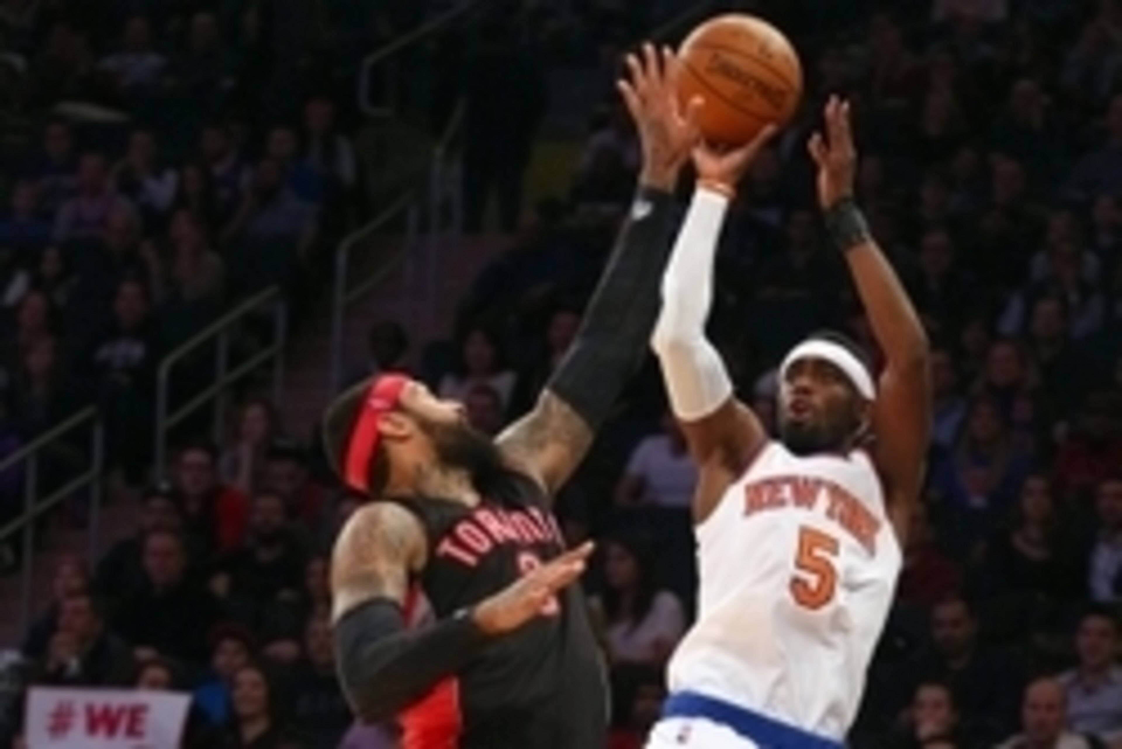 Feb 28, 2015; New York, NY, USA; New York Knicks shooting guard Tim Hardaway Jr. (5) shoots over Toronto Raptors power forward James Johnson (3) during the second half at Madison Square Garden. Mandatory Credit: Brad Penner-USA TODAY Sports