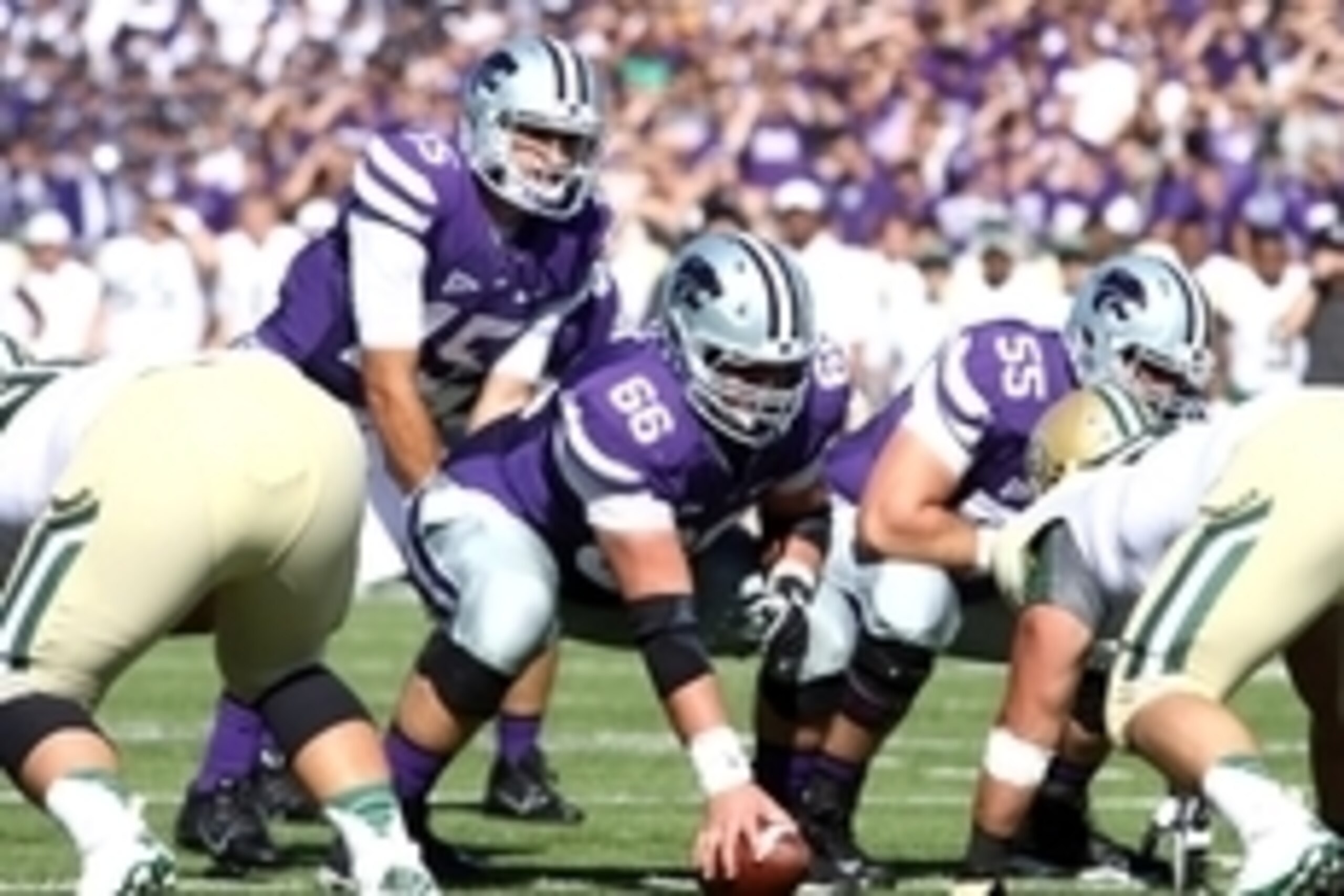 Oct 12, 2013; Manhattan, KS, USA; Kansas State Wildcats quarterback Jake Waters (15) waits to take the snap from center BJ Finney (66) during first-half action against the Baylor Bears at Bill Snyder Family Stadium. Mandatory Credit: Scott Sewell-USA TODA Oct 12, 2013; Manhattan, KS, USA; Kansas State Wildcats quarterback Jake Waters (15) waits to take the snap from center BJ Finney (66) during first-half action against the Baylor Bears at Bill Snyder Family Stadium. Mandatory Credit: Scott Sewell-USA TODA