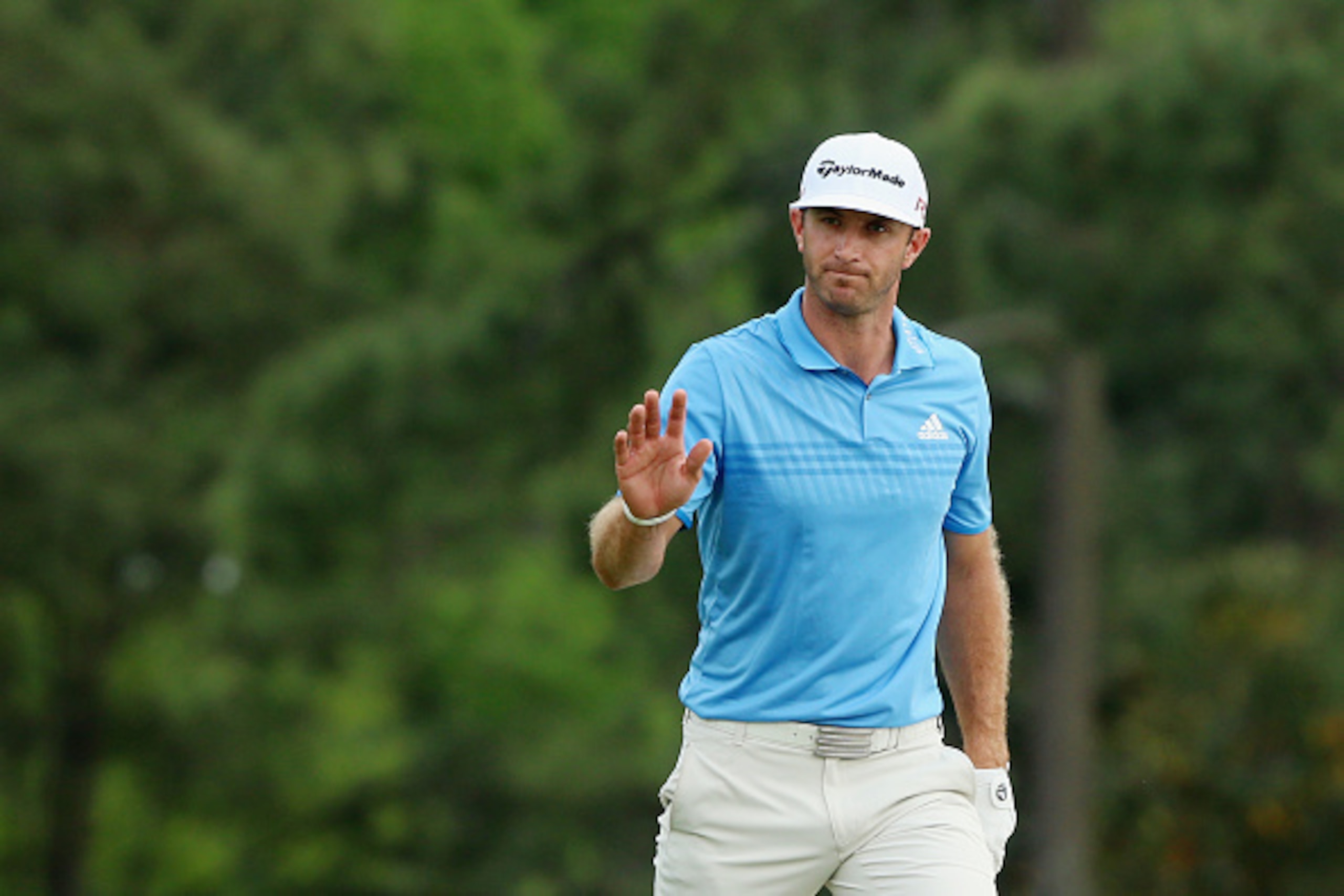 AUGUSTA, GA - APRIL 10:  Dustin Johnson of the United States walks across the 18th green during the second round of the 2015 Masters Tournament at Augusta National Golf Club on April 10, 2015 in Augusta, Georgia.  (Photo by Andrew Redington/Getty Images)