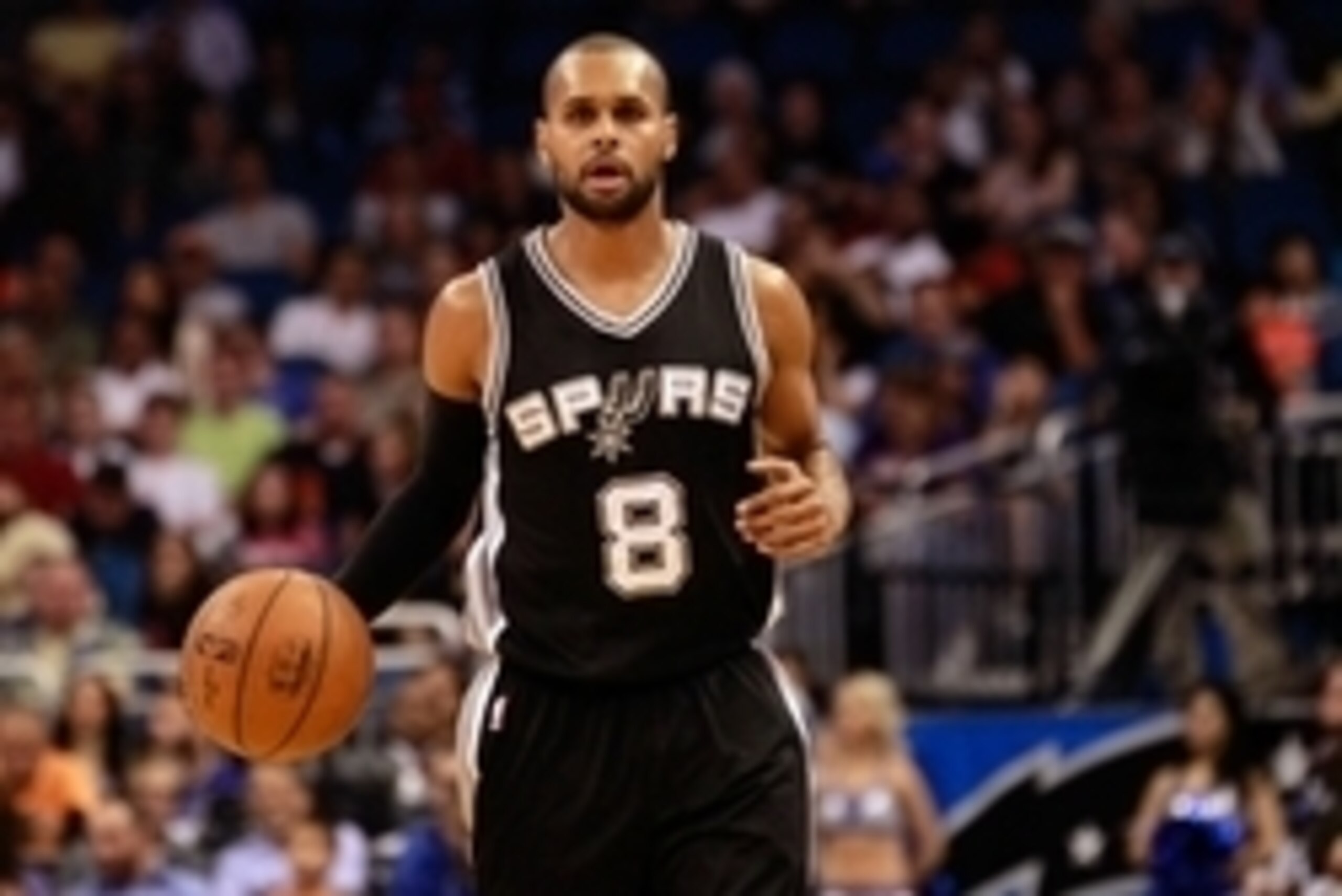 Apr 1, 2015; Orlando, FL, USA; San Antonio Spurs guard Patty Mills (8) drives to the basket against the Orlando Magic during the second half at Amway Center. San Antonio Spurs defeated the Orlando Magic 103-91. Mandatory Credit: Kim Klement-USA TODAY Spor