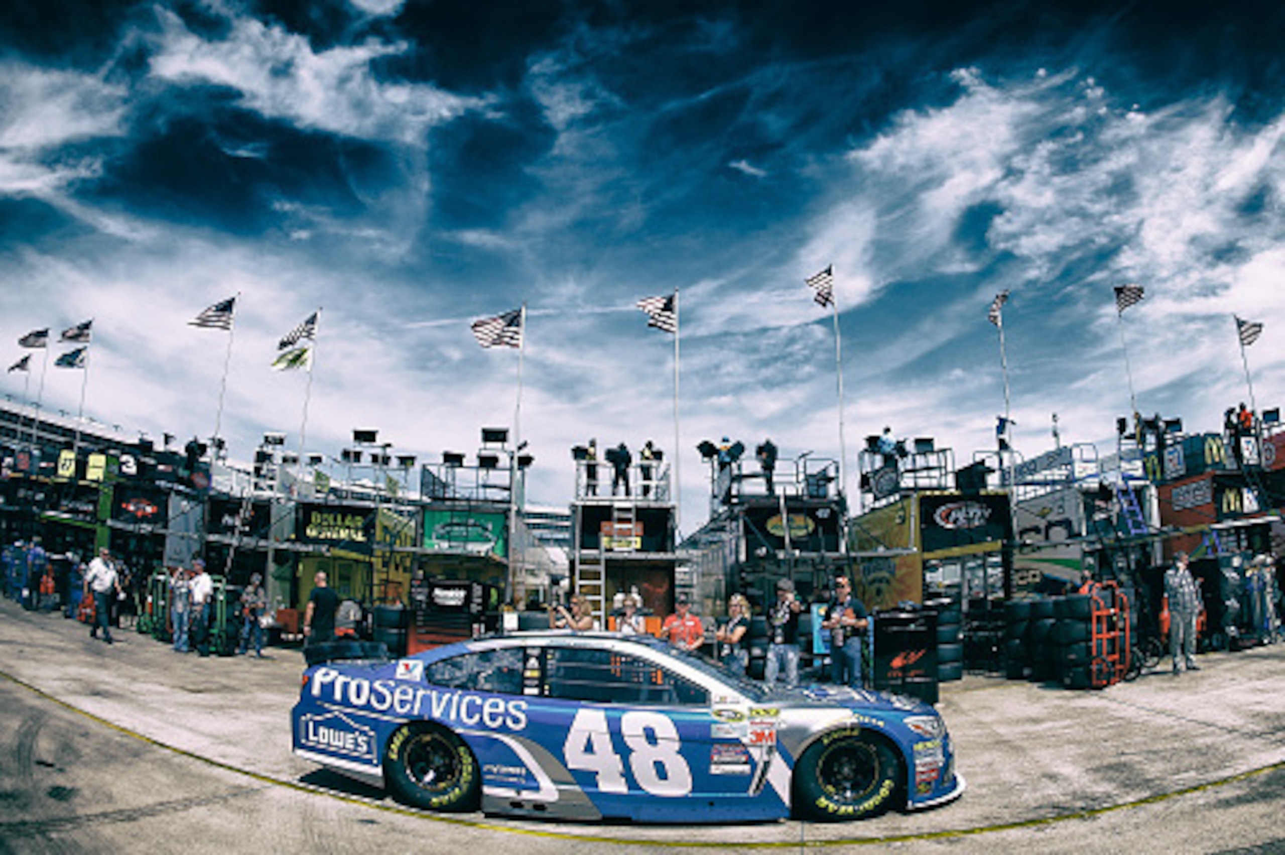 FORT WORTH, TX - APRIL 10:  (EDITORS NOTE: Image has been processed using digital filters) Jimmie Johnson, driver of the #48 Lowe's Pro Services Chevrolet, drives through the garage area during practice for the NASCAR Sprint Cup Series Duck Commander 500 