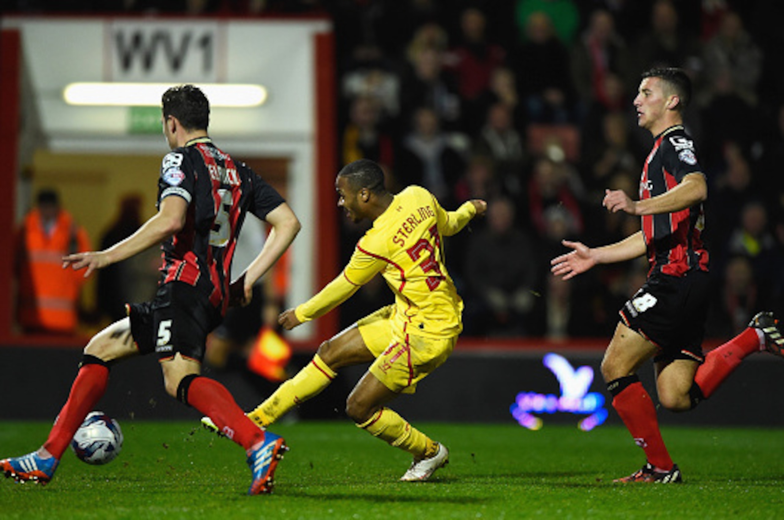 BOURNEMOUTH, ENGLAND - DECEMBER 17:  Raheem Sterling of Liverpool scores his team's third goal during the Capital One Cup Quarter-Final match between Bournemouth and Liverpool at Goldsands Stadium on December 17, 2014 in Bournemouth, England.  (Photo by M