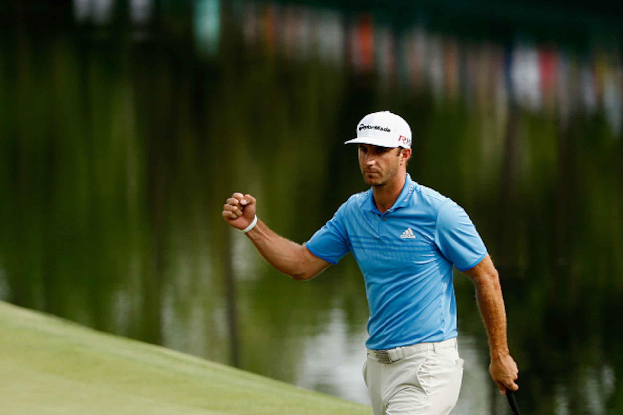 AUGUSTA, GA - APRIL 10:  Dustin Johnson of the United States makes a long birdie putt on the 16th green during the second round of the 2015 Masters Tournament at Augusta National Golf Club on April 10, 2015 in Augusta, Georgia.  (Photo by Ezra Shaw/Getty 