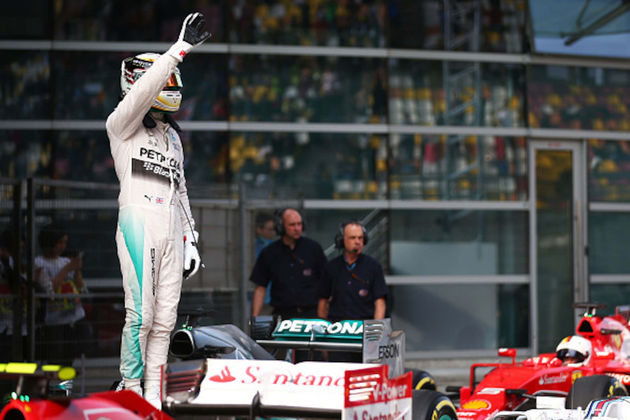 SHANGHAI, CHINA - APRIL 11:  Lewis Hamilton of Great Britain and Mercedes GP waves to the fans after securing pole position during qualifying for the Formula One Grand Prix of China at Shanghai International Circuit on April 11, 2015 in Shanghai, China.  