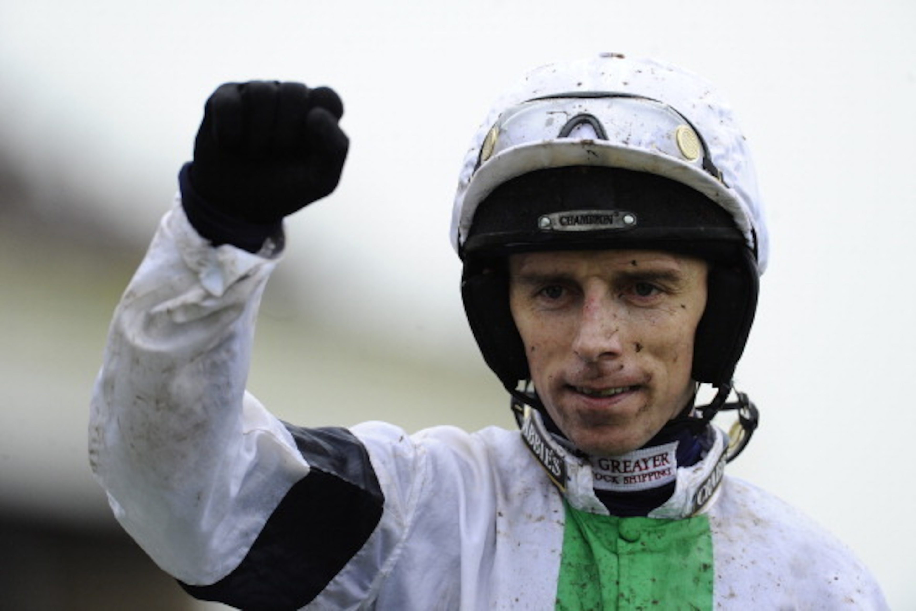 LIVERPOOL, ENGLAND - APRIL 05:  Leighton Aspell riding Pineau De Re win The Crabbie's Grand National Steeple Chase at Aintree racecourse on April 05, 2014 in Liverpool, England. (Photo by Alan Crowhurst/Getty Images)