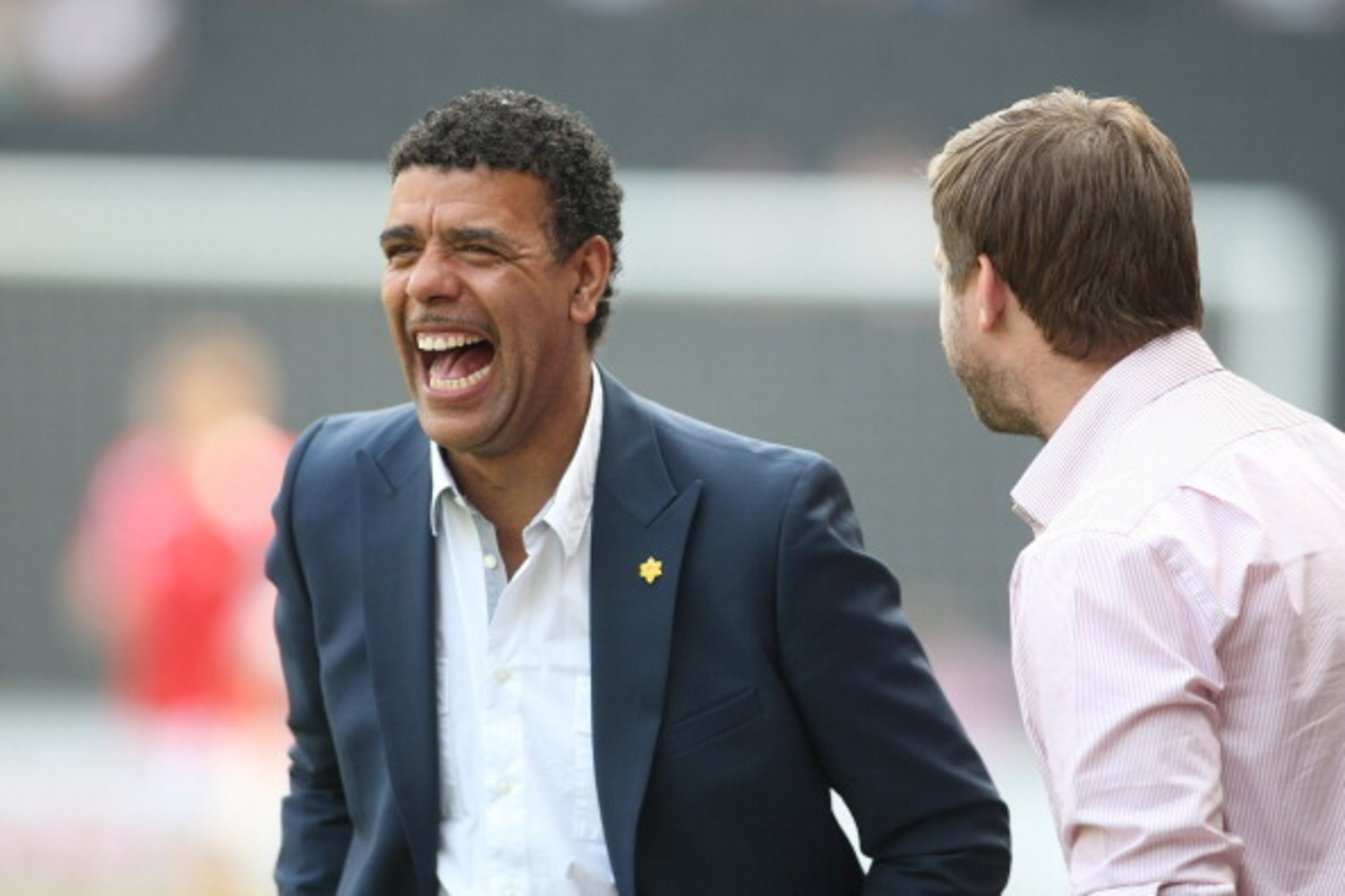 MILTON KEYNES, ENGLAND - APRIL 22: Sky TV pundit Chris Kamara talks to MK Dons manager Karl Robinson prior to the npower League One match between MK Dons and Huddersfield Town at Stadium mk on April 22, 2011 in Milton Keynes, England. (Photo by Pete Norto