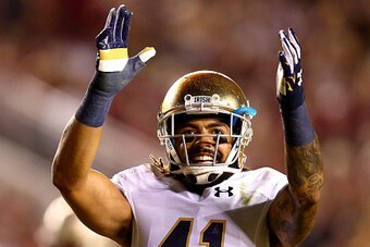 TALLAHASSEE, FL - OCTOBER 18:  Matthias Farley #41 of the Notre Dame Fighting Irish reacts to the crowd during their game against the Florida State Seminoles at Doak Campbell Stadium on October 18, 2014 in Tallahassee, Florida.  (Photo by Streeter Lecka/G