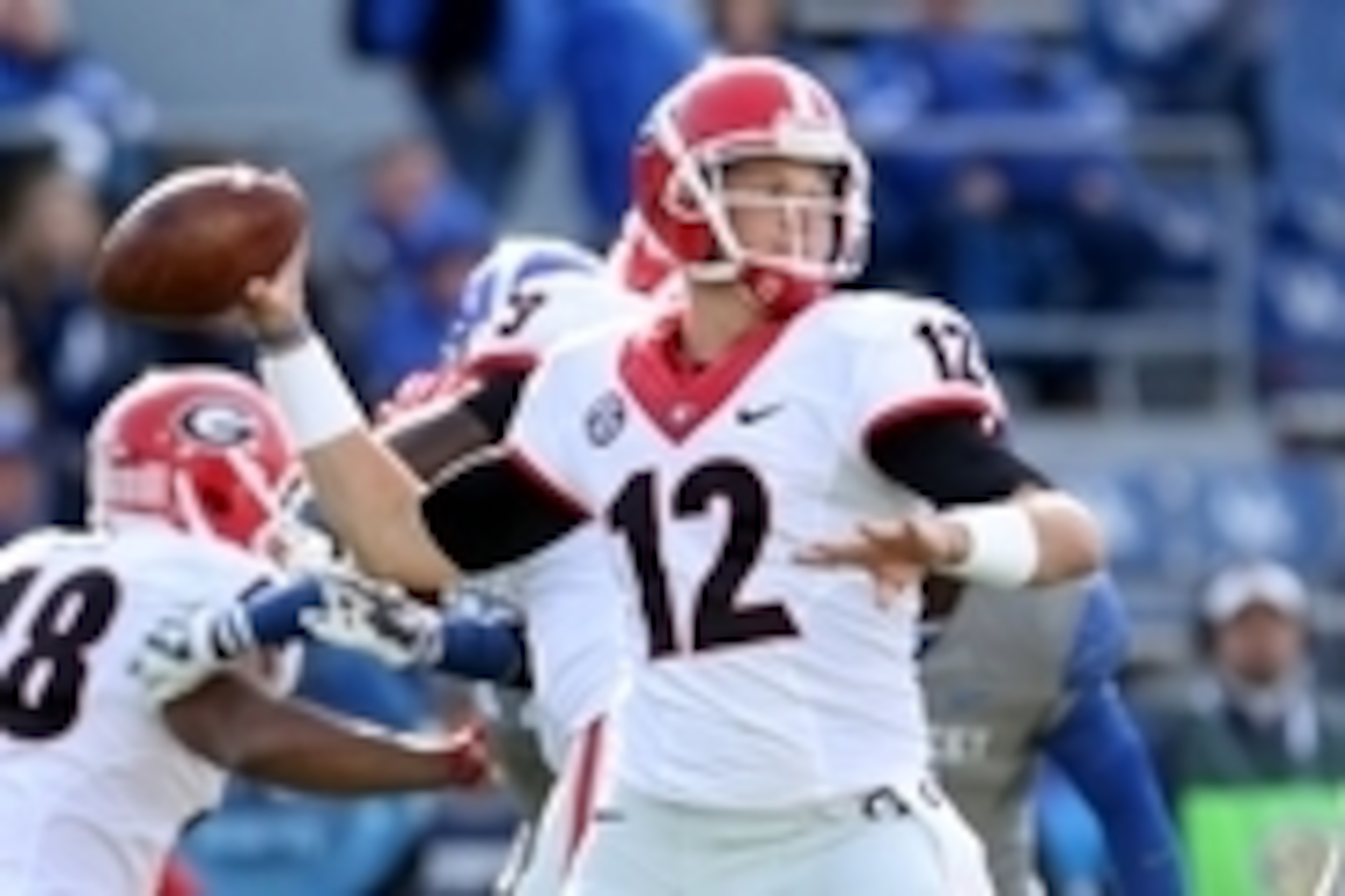 Nov 8, 2014; Lexington, KY, USA; Georgia Bulldogs quarterback Brice Ramsey (12) throws a pass against the Kentucky Wildcats in the second half at Commonwealth Stadium. Georgia defeated Kentucky 63-31. Mandatory Credit: Mark Zerof-USA TODAY Sports