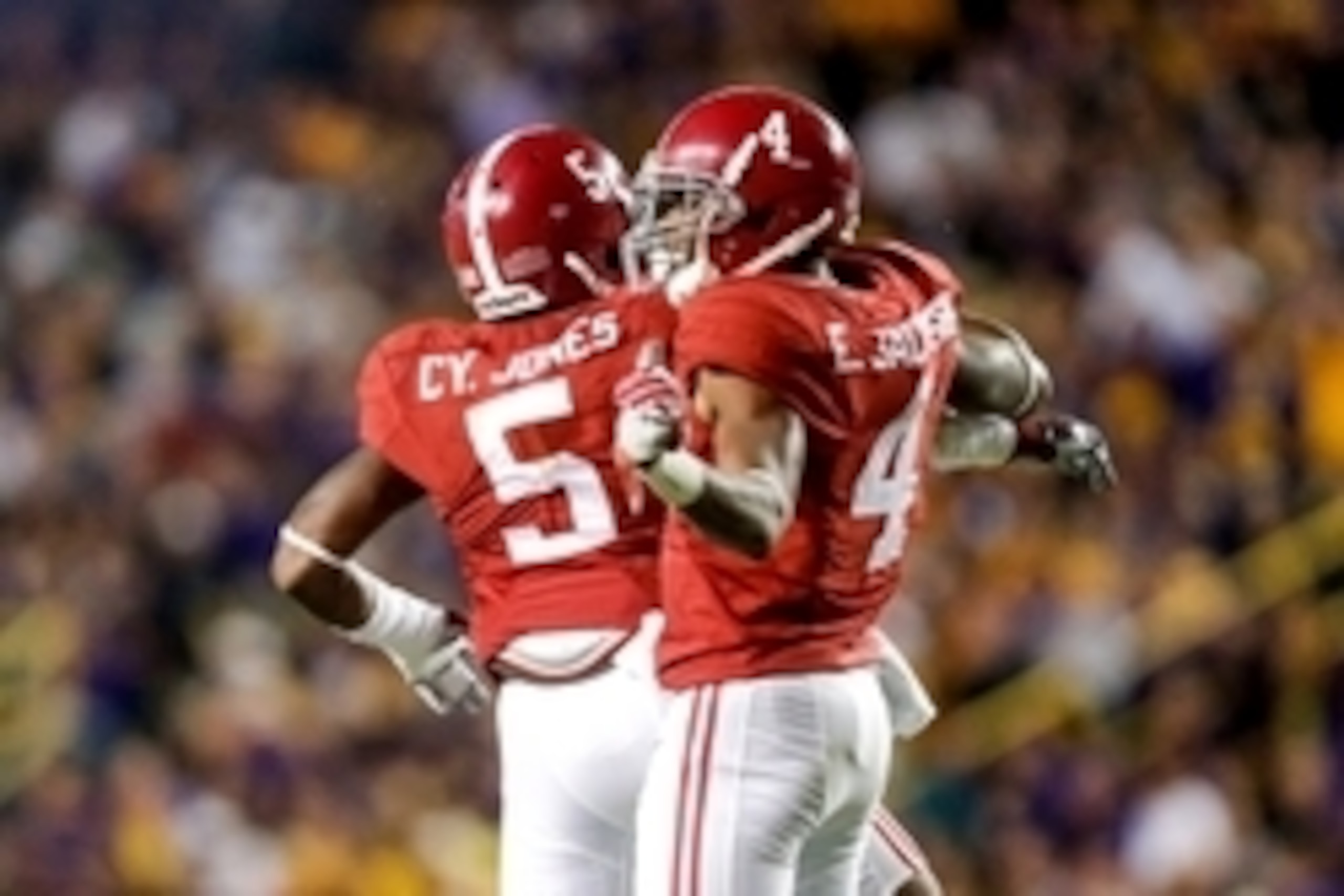 Nov 8, 2014; Baton Rouge, LA, USA; Alabama Crimson Tide defensive back Eddie Jackson (4) celebrates  with defensive back Cyrus Jones (5) after an interception against the LSU Tigers during the second quarter of a game at Tiger Stadium. Mandatory Credit: D