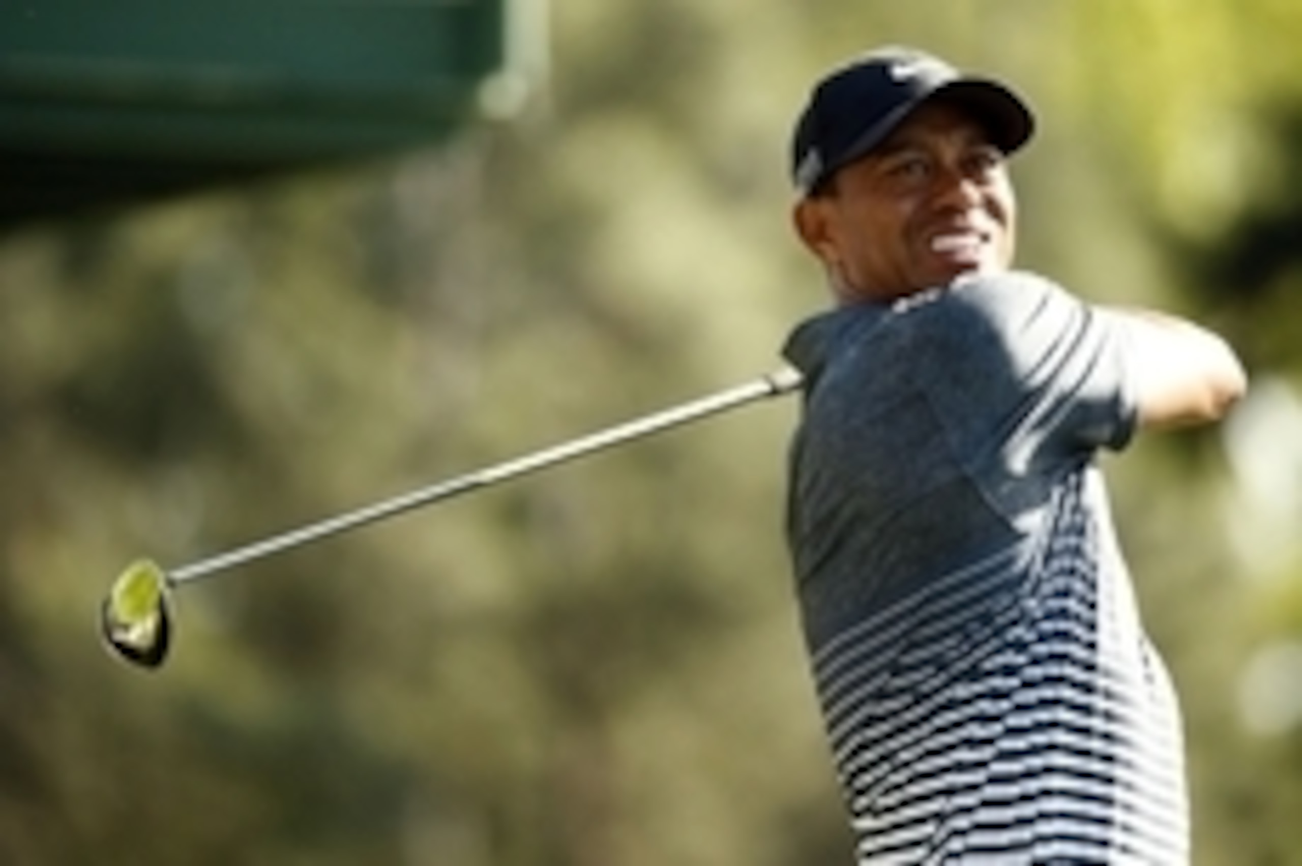 Apr 11, 2015; Augusta, GA, USA; Tiger Woods hits his tee shot on the 18th hole during the third round of The Masters golf tournament at Augusta National Golf Club. Mandatory Credit: Rob Schumacher-USA TODAY Sports