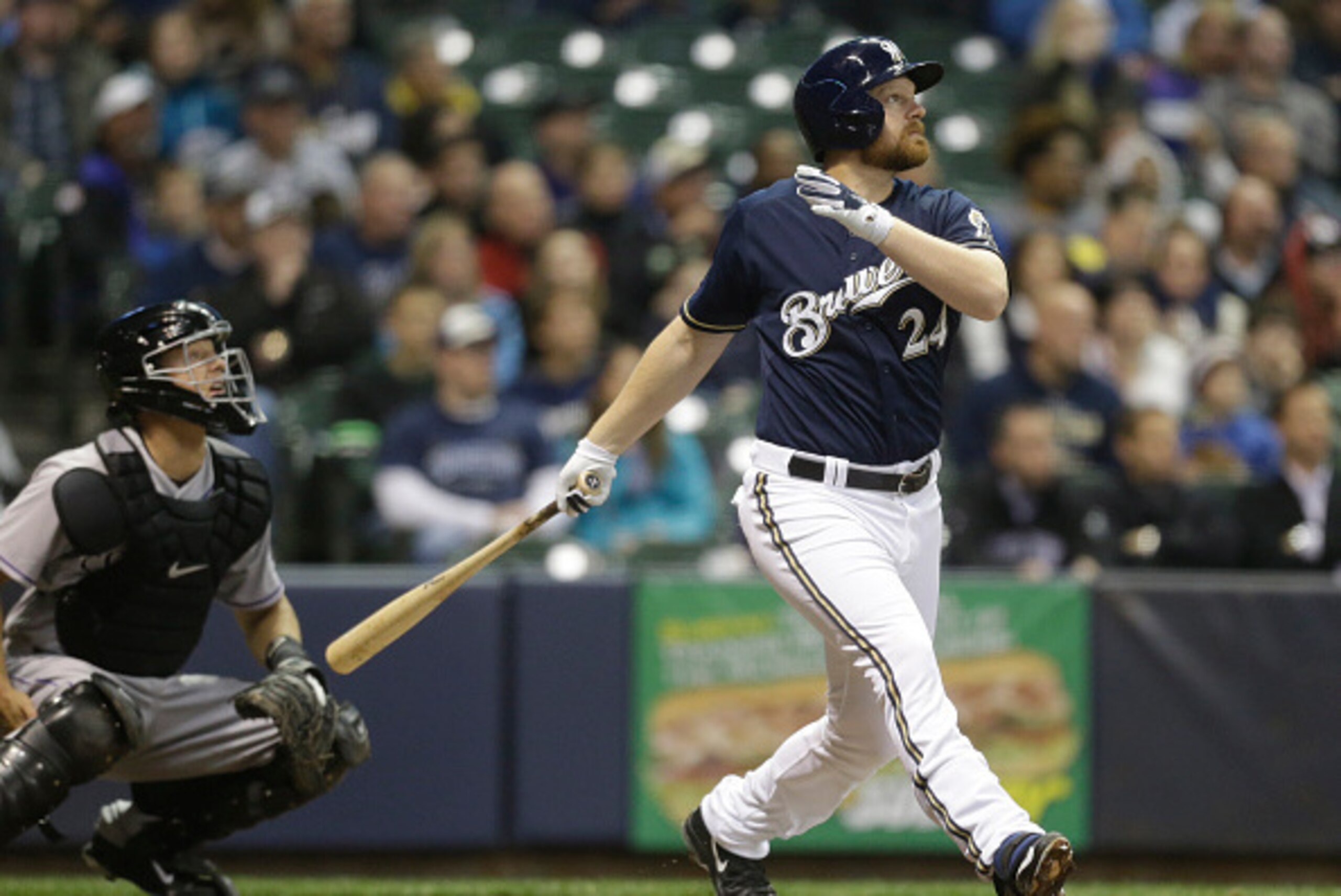 MILWAUKEE, WI -APRIL 8: Adam Lind #24 of the Milwaukee Brewers watches his two run home run against the Colorado Rockies in the third inning at Miller Park on April 8, 2015 in Milwaukee, Wisconsin.  (Photo by Jeffrey Phelps/Getty Images)