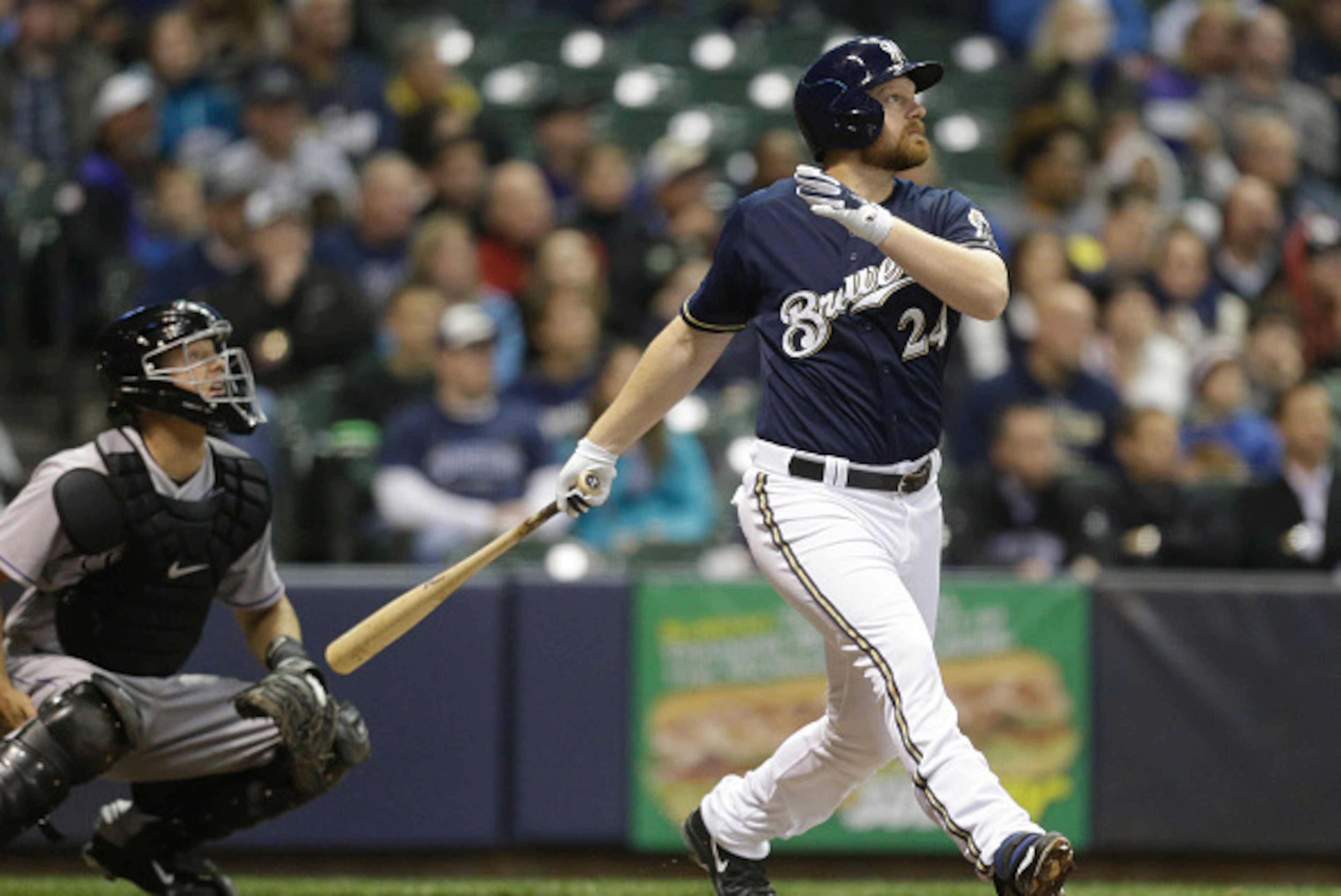 MILWAUKEE, WI -APRIL 8: Adam Lind #24 of the Milwaukee Brewers watches his two run home run against the Colorado Rockies in the third inning at Miller Park on April 8, 2015 in Milwaukee, Wisconsin.  (Photo by Jeffrey Phelps/Getty Images)