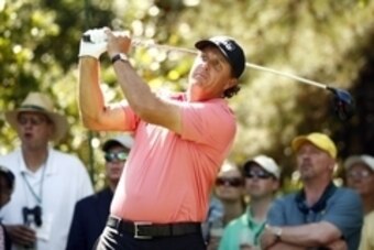 Apr 11, 2015; Augusta, GA, USA; Phil Mickelson hits his tee shot on the 7th hole during the third round of The Masters golf tournament at Augusta National Golf Club. Mandatory Credit: Rob Schumacher-USA TODAY Sports