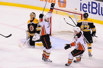 BOSTON, MA - MARCH 26: Ryan Getzlaf #15 and Corey Perry #10 of the Anaheim Ducks celebrate an overtime goal against the Boston Bruins at the TD Garden on March 28, 2015 in Boston, Massachusetts.  (Photo by Steve Babineau/NHLI via Getty Images)