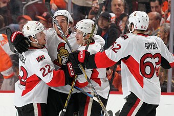 PHILADELPHIA, PA - APRIL 11: Mark Stone #61 of the Ottawa Senators celebrates his third period goal against the Philadelphia Flyers, his second of the game, with teammates Erik Condra #22, Kyle Turris #7, and Eric Gryba #62 on April 11, 2015 at the Wells 