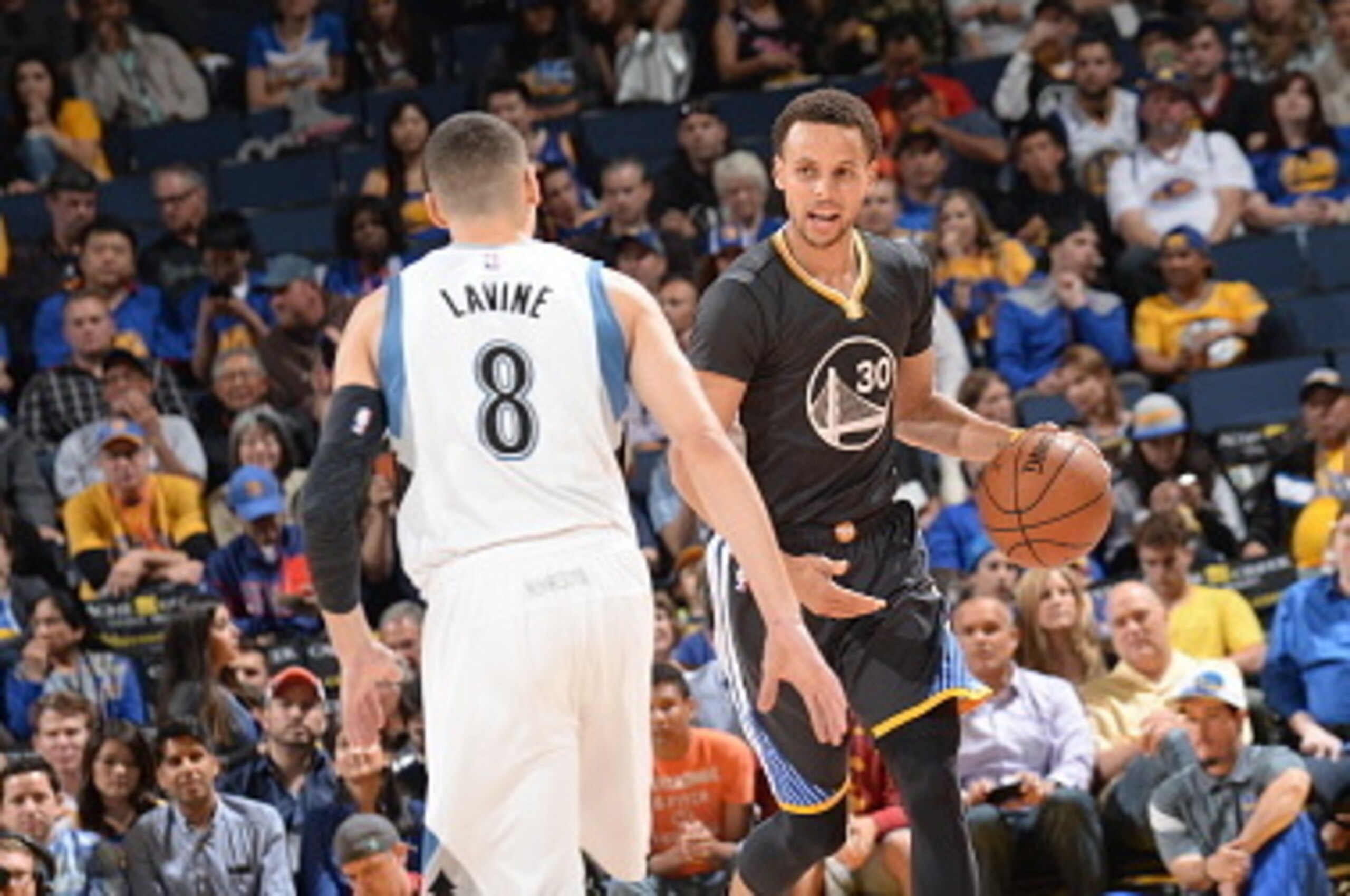 OAKLAND, CA - APRIL 11: Stephen Curry #30 of the Golden State Warriors brings the ball up court against Zach LaVine #8 of the Minnesota Timberwolves on April 11, 2015 at ORACLE Arena in Oakland, California. NOTE TO USER: User expressly acknowledges and a OAKLAND, CA - APRIL 11: Stephen Curry #30 of the Golden State Warriors brings the ball up court against Zach LaVine #8 of the Minnesota Timberwolves on April 11, 2015 at ORACLE Arena in Oakland, California. NOTE TO USER: User expressly acknowledges and a