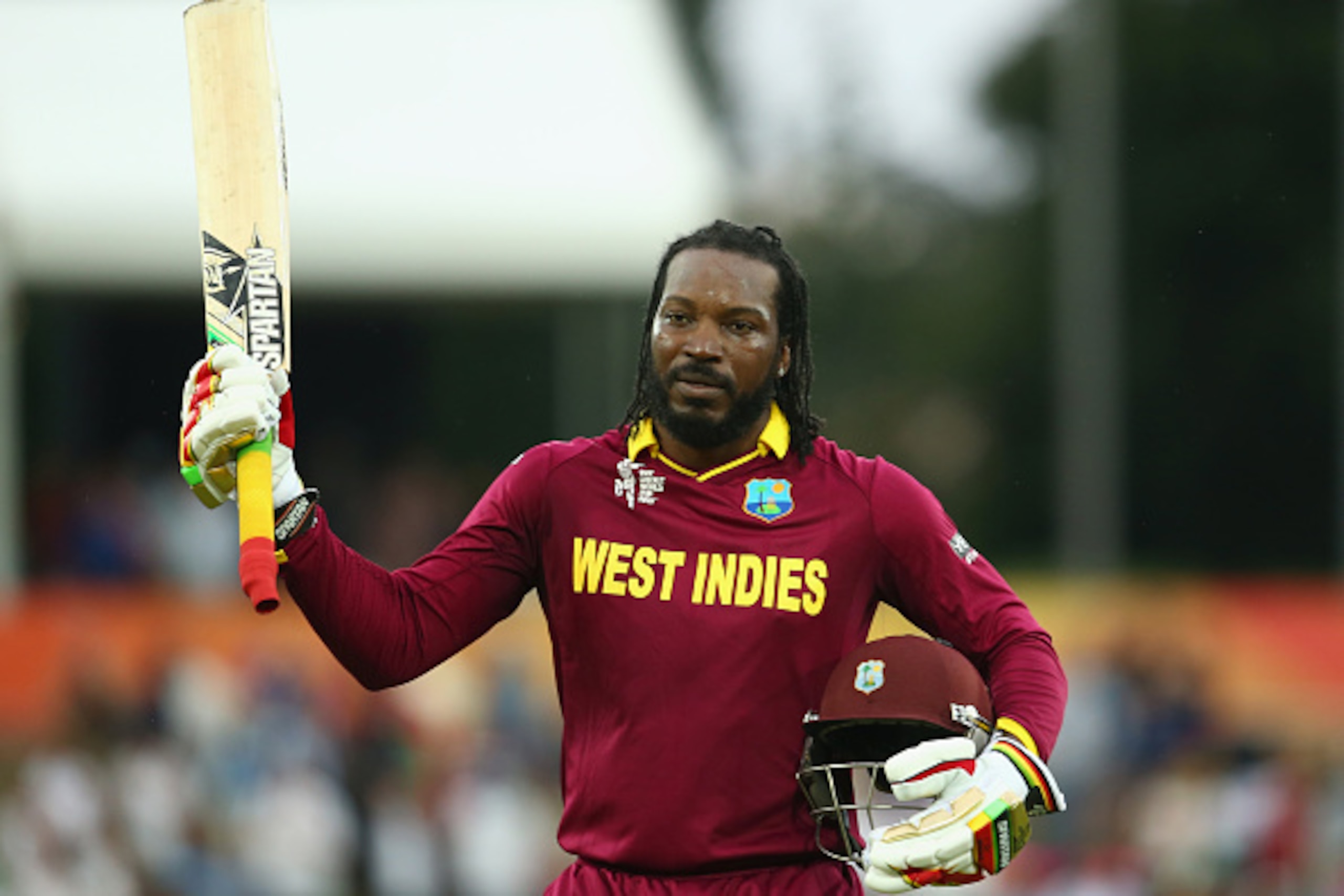CANBERRA, AUSTRALIA - FEBRUARY 24:  Chris Gayle of West Indies acknowledges the crowd as he leaves the field after scoring 215 during the 2015 ICC Cricket World Cup match between the West Indies and Zimbabwe at Manuka Oval on February 24, 2015 in Canberra